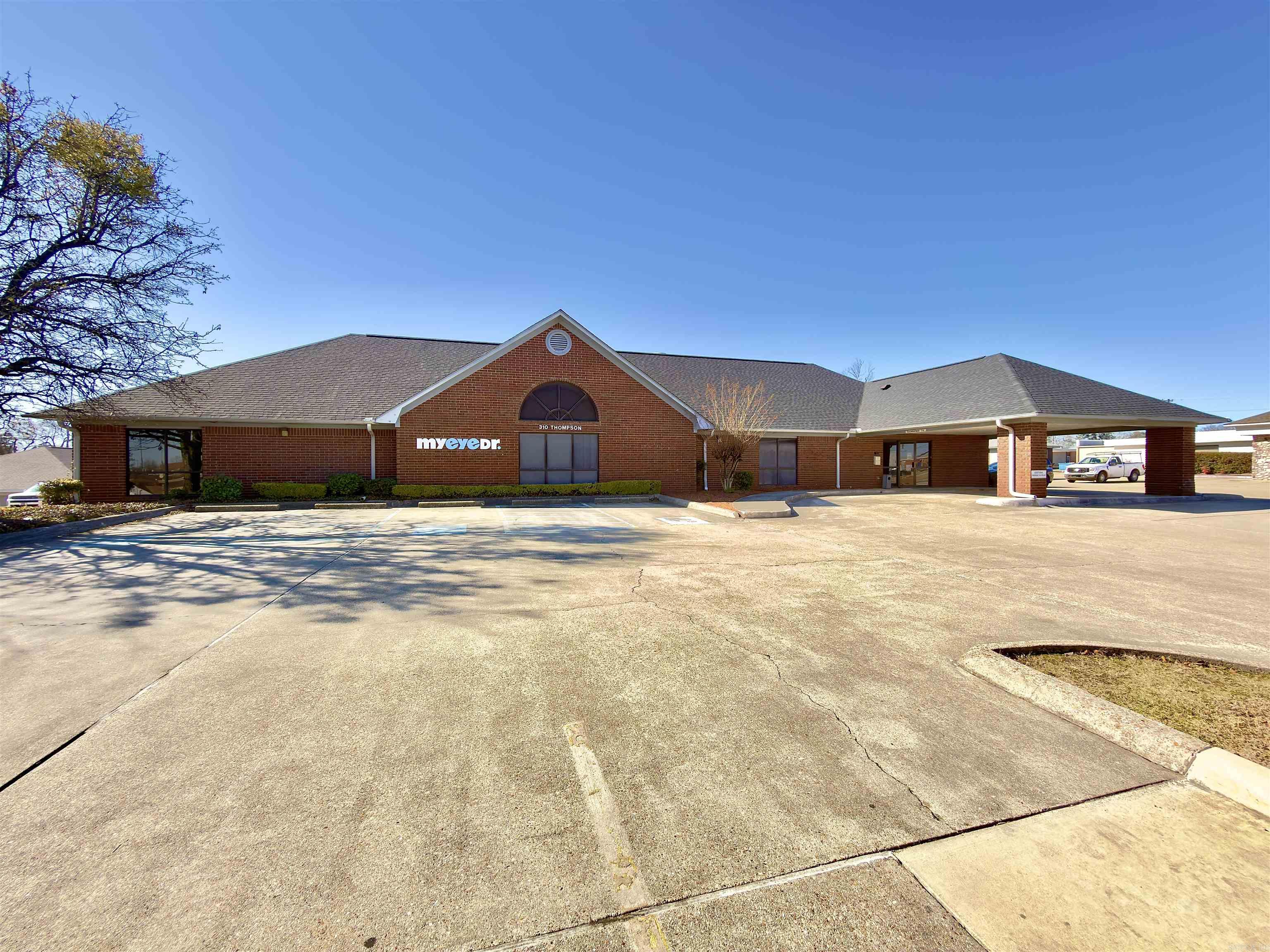 Investment opportunity in a strong, high-visibility location. This commercial property at 310 Thompson Ave in El Dorado offers over 14,000 square feet of versatile space sitting on approximately 1.47 acres.  A portion of the building is currently leased, providing immediate income for an investor while leaving additional space available for owner-occupancy or future tenants. The flexible layout makes it ideal for medical offices, professional office space, retail, service-based businesses, or a multi-tenant setup.  Major updates include a new roof in 2024, giving peace of mind and reducing near-term capital expenses. The large lot allows for ample parking and easy access for clients and customers.  If you’re looking for a solid income-producing property with room to grow, this one checks the boxes.