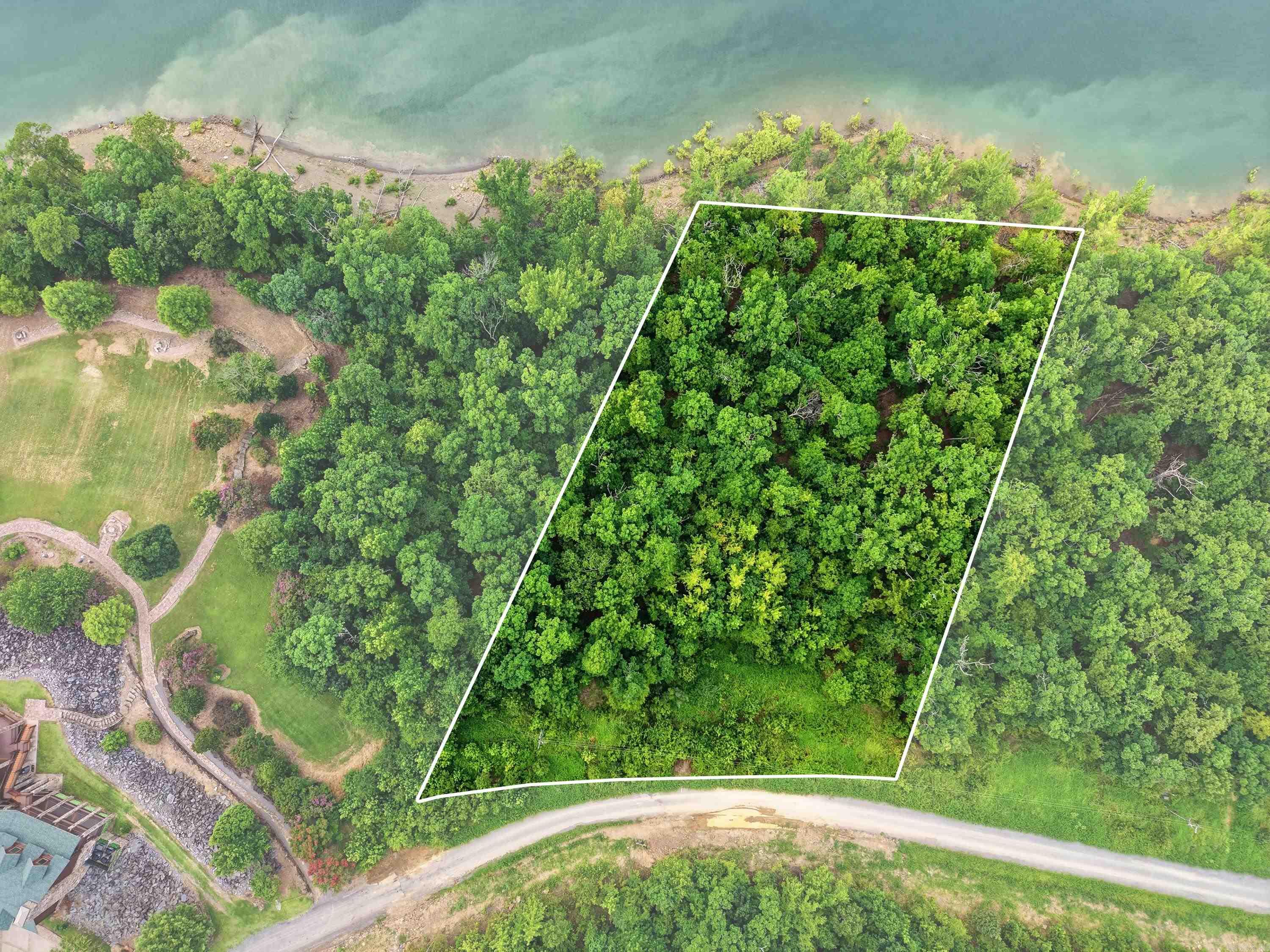 Lakefront Living on Greers Ferry Lake! Discover the perfect place to build your dream home on this beautiful lakefront lot. Nestled along the crystal-clear waters of Greers Ferry Lake, this exceptional property offers the peaceful setting you've been searching for. Enjoy stunning lake views, direct access to the shoreline, and endless opportunities for boating, fishing, kayaking, and relaxing by the water. Mature trees provide natural beauty and privacy while creating an ideal backdrop for your custom lake retreat. Conveniently located near marinas, public boat launches, and just a short drive to Clinton. For restaurants and shopping. Whether you're planning a weekend getaway or your forever home, this is a rare opportunity to own a piece of one of Arkansas' most beautiful lakes. Don't miss your chance to experience the lake lifestyle you've always dreamed of!