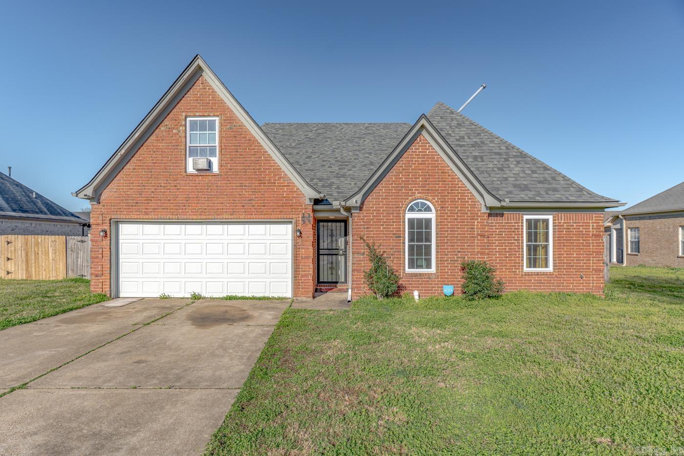 Welcome to market 818 Boulevard Orleans St. in Marion, AR! This beautiful 4 bedroom, 2 bathroom home offers a desirable open concept layout connecting the kitchen, dining, and living areas, perfect for entertaining and everyday living. The main level features three bedrooms, including a primary suite with a private bathroom, while the spacious fourth bedroom upstairs offers the perfect flex space for a guest room, home office, playroom, or bonus room. Step outside to enjoy the fully fenced backyard with a wood privacy fence, ideal for relaxing, pets, or gatherings, plus a storage shed for added convenience. Solar panels provide added energy efficiency and potential savings on utility costs. Located just minutes from I-55 and only 13 miles from Memphis! This home offers the perfect combination of comfort, space, and convenience. Call today to schedule your showing!!