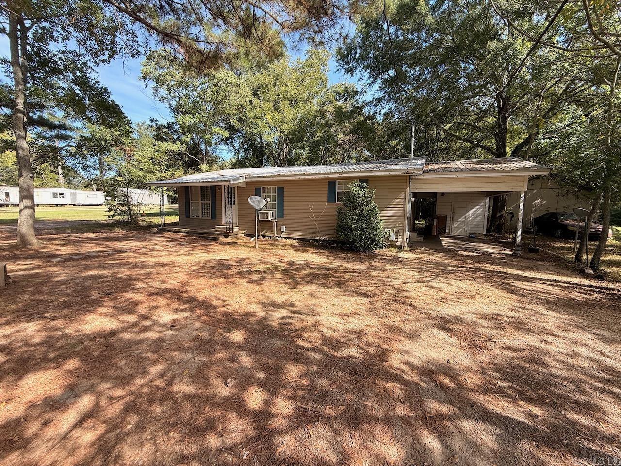 2 bedroom 1 bathroom with rustic wood interior.  Metal roof, carport, ample parking.  Cash flow opportunity as a rental or good for affordable living.