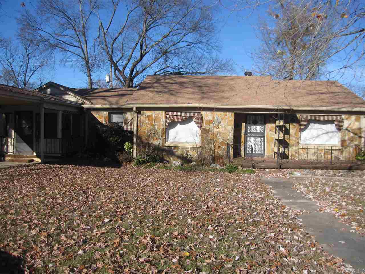 This is the cutest home! home is a 3 bedroom but could be converted easily to a 2 bedroom with 2 living areas. Fireplace in den.- Hardwood floors in all bedrooms and dinning and living room Den is carpeted. Huge sun room across the back and a small sun room on the front of the home, Huge front porch on the front of the home. Call me to see this home today. measuring encouraged. Seller will do owner financing with approved buyer.