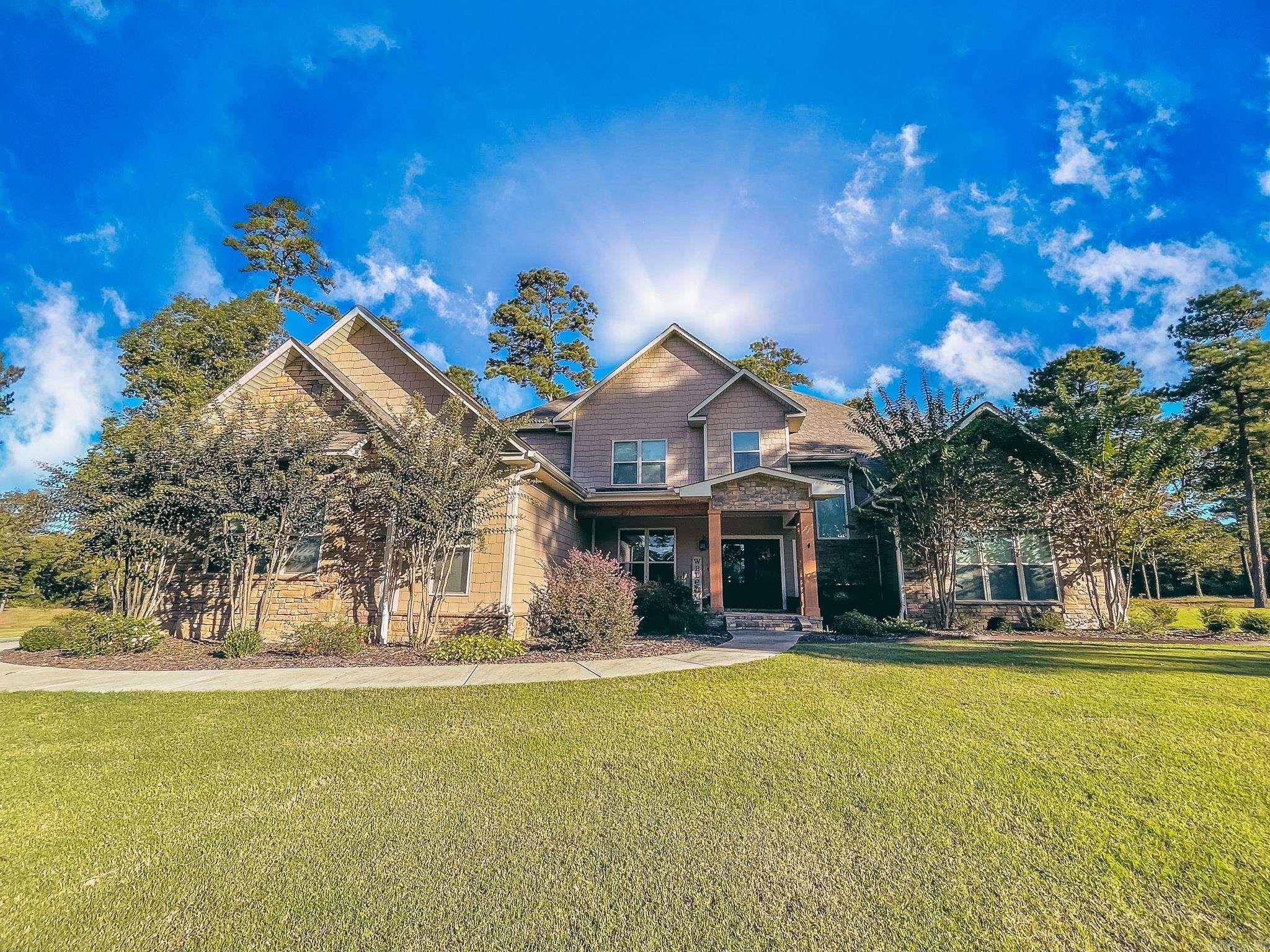 Welcome to 158 Pine Needles Drive in the Mystic Creek Golf Community, where everyday living feels like a getaway. Tucked into the rolling, timber-lined setting west of El Dorado, Mystic Creek is known for its 18-hole championship course and full practice facility and has been recognized as the #1 course in Arkansas by Golfweek.   This 4 bedroom / 3 bath home is built for real life and entertaining, featuring a dedicated workout room plus a bonus room—perfect for a game room, second living area, media space, or home office.   Step outside and you’ll see where this one really shines: an outdoor kitchen and fireplace that turn your backyard into the ultimate hosting zone!  If you’re looking for a home that pairs space + function with that “Mystic Creek lifestyle,” this is it.