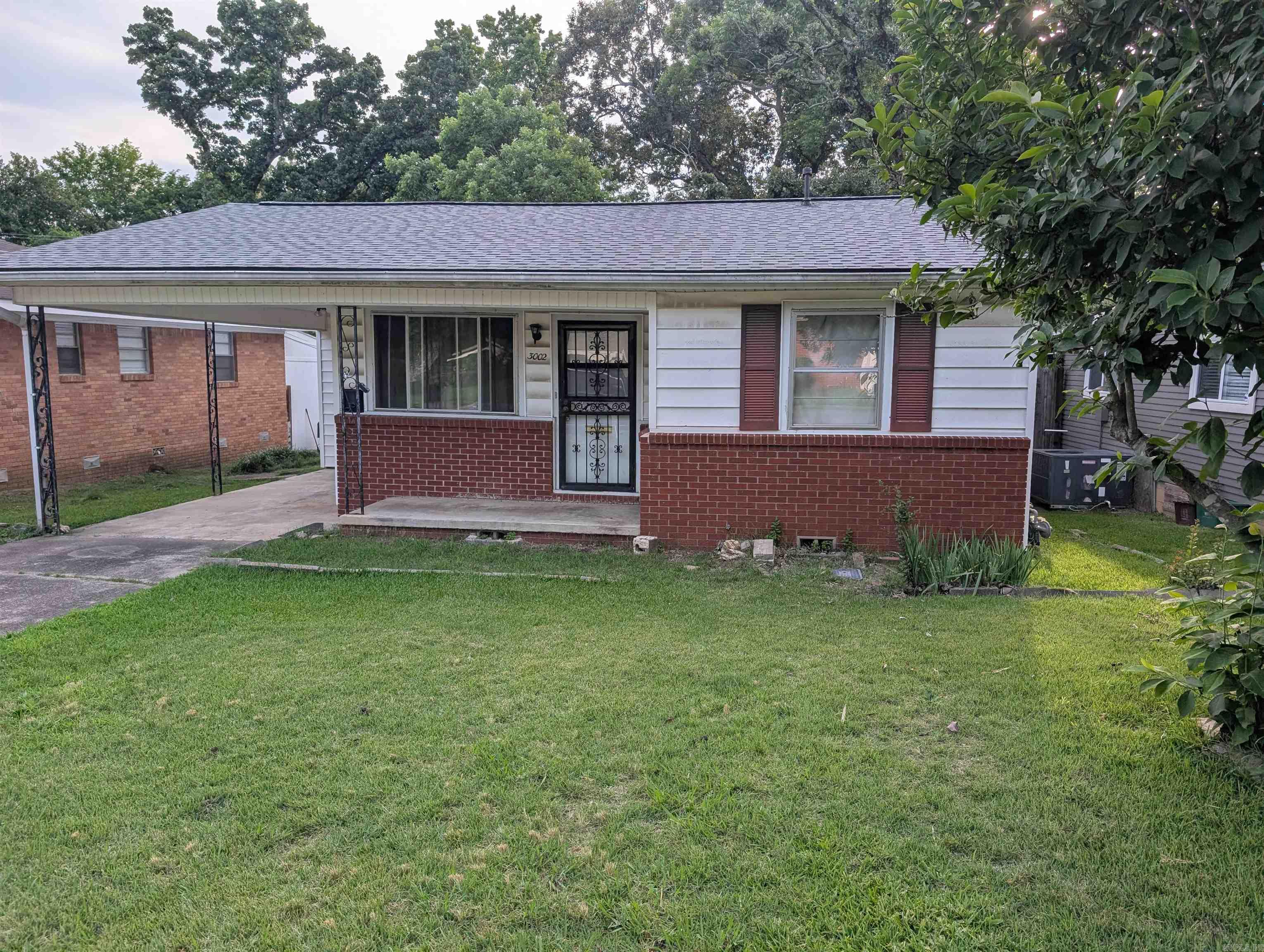 This cute 2 bedroom 1 full bath home offers a family room and eat in kitchen.  Relax in private screened in porch overlooking the back yard.  Home just had a NEW Roof installed.  Would make a great investment property.  Within walking distance to UALR.  Agents see confidential remarks