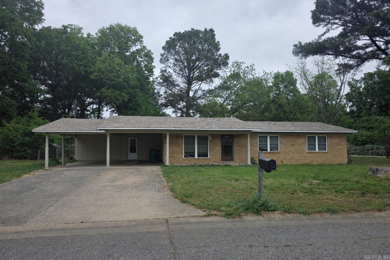 PICTURES Added-  3 bed 2 bath brick home with an office/4th bedroom /dining room on a large corner lot centrally located in Conway. Big ticket improvements already done include: Architectural Roof 2020, HVAC 2020, HWH 2018, Graceland Storage building 10 x 12 put in in 2023. This home also features a covered carport and a functional layout with plenty of storage, built-ins, and Nice sized living room out to covered back patio. Fenced in Backyard. Priced to allow room for a buyer’s personal updates.