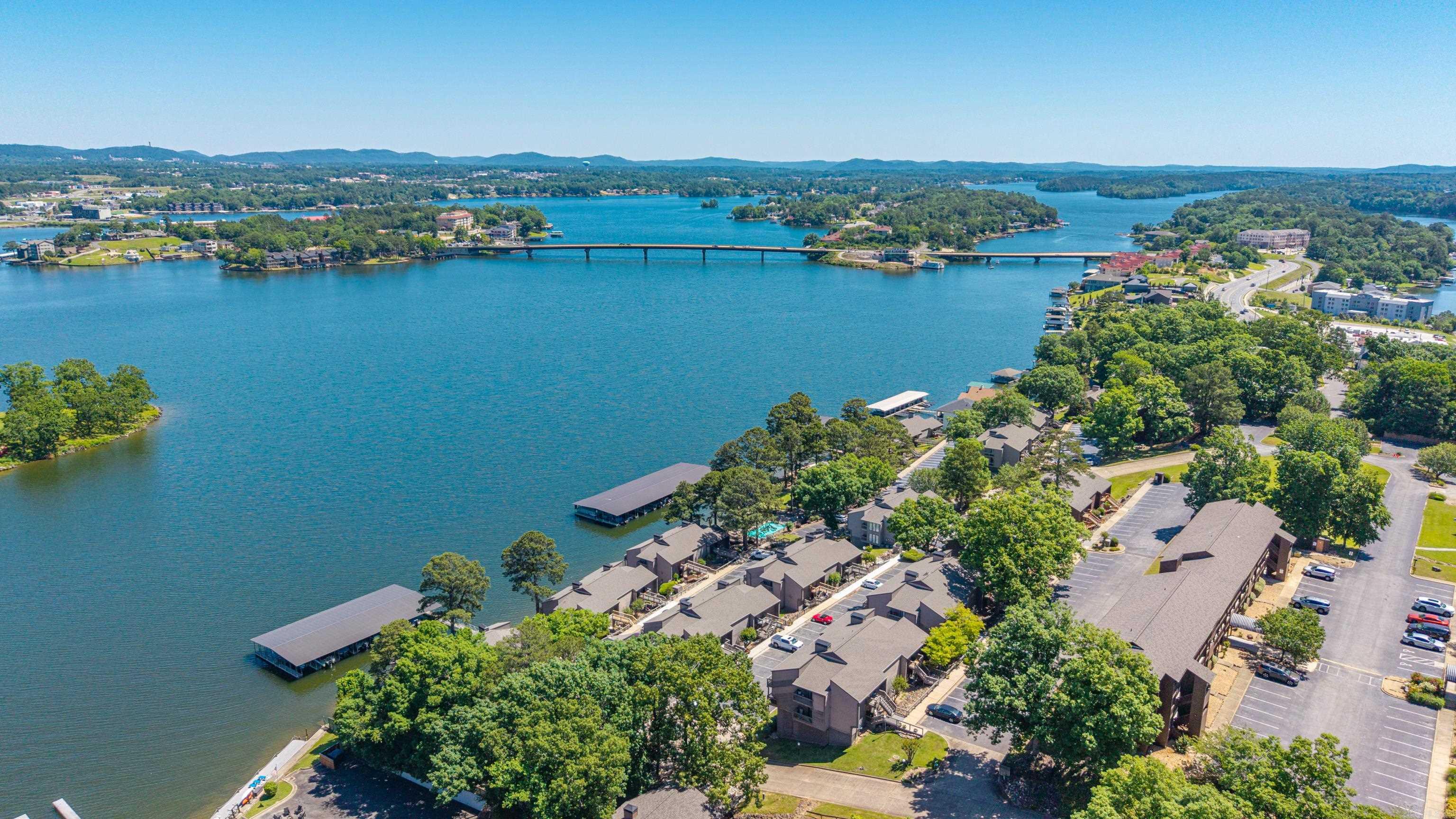 Welcome to effortless lake living at 200 Hamilton Oaks Drive, Unit D3, in the gated South Shore community on beautiful Lake Hamilton. This newly remodeled 2-bedroom, 2-bath waterfront condo is an ideal full-time residence, vacation getaway, or income-producing investment.  Enjoy the convenience of entry-level access with no steps, making this home easily accessible for owners and guests alike. Inside, you'll find an inviting open floor plan with tasteful updates, a cozy wood-burning fireplace, and abundant natural light. Step onto the spacious private balcony and relax while taking in peaceful views of Lake Hamilton.  This turnkey property is being offered fully furnished, with furniture, furnishings, and contents conveying to the new owner, making it ready to enjoy or continue as a successful short-term rental. The condo has an established Airbnb history with excellent guest reviews and local property management already in place.  Residents of South Shore enjoy resort-style amenities, including gated security, swimming pools, hot tub, tennis courts, beautifully maintained grounds, and convenient access to Lake Hamilton. Located just minutes from Oaklawn, and downtown Hot Springs