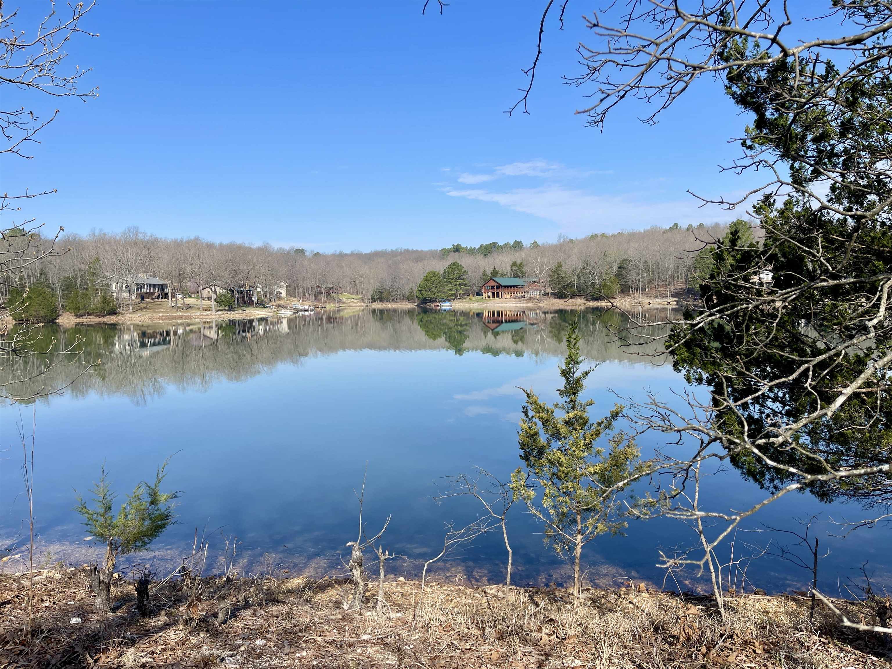 Lakefront Living Opportunity – Build Ready Lot on Lake Chanute in Fulton County, Arkansas This build-ready property offers a current perc test approved for up to a 4-bedroom home, making it ideal for a full-time residence, vacation getaway, or investment property. Lake Chanute, a peaceful 65-acre no-wake lake known for its quiet atmosphere and excellent recreational opportunities. Whether you're into bass, crappie, or catfish fishing, or prefer kayaking and pontoon boating, this area delivers true Ozarks lifestyle appeal. Property features include high-speed fiber internet availability, giving you modern convenience in a scenic, rural setting. Outdoor enthusiasts will appreciate being just a short drive from the Spring River and South Fork River, offering additional options for floating, fishing, and exploring. Golf lovers will enjoy nearby access to two 18-hole golf courses, adding even more value and recreation to this desirable location.