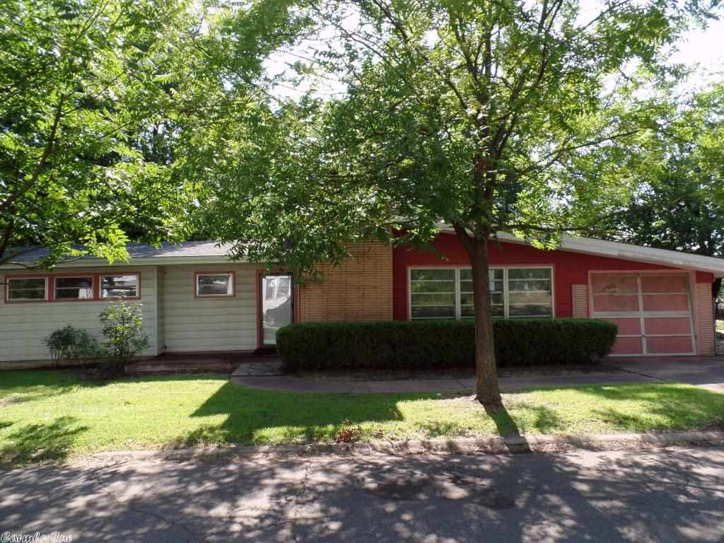 One story brick & frame ranch style home situated on a level corner lot within the city of Hope AR. Home features: 3 bedrooms, 1 bathroom, central heat, living room with WBFP, attached 1 car garage, extra parking pad, open porch and fenced backyard. 1563 (approximately) square feet of gross living area above grade. HUD Case #031-315038, FHA Financing: IE (Insured Escrow), "For more information see agent remarks".