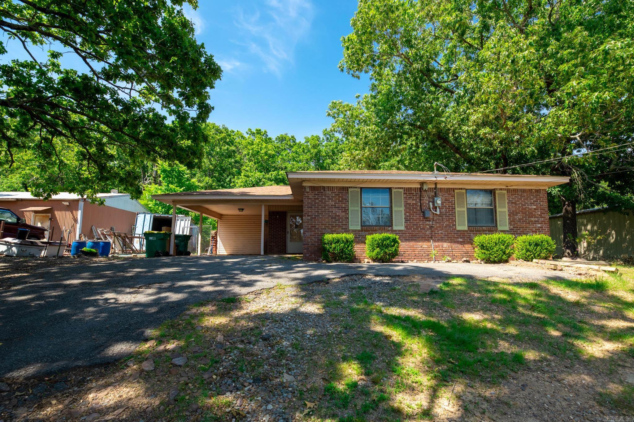 Great earning potential. This 3 bd 1.5 bath home is being sold with the lot next door.  The home features 2 large living areas .There is a metal shop on the lot which is currently renting for $550 mo. House has been rented to last tenant for several years at 850.00 mo.  Roof is 2 years old, hot water heater , stove and sewer lines have been replaced. Great for investor wanting to add to portfolio or first time home buyer. Home needs paint and carpet. See Agent remarks