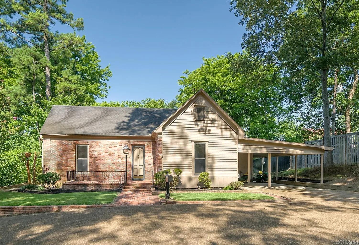 Beautiful home nested into a private cove right in the middle of Forrest City!  Recent improvements include fresh exterior paint and repairs. Fresh interior paint on walls, trim and ceilings. New Carpet. New Hot Water Tank. Updated Baths. This is a VERY large 2 bedroom home. The main bedroom has a giant closet that could be used for many purposes - even an office! The main living space is grand with high ceilings.  Natural light flows wonderfully through the home and the screen porch is perfectly secluded and in a great spot to catch the evening sunsets.