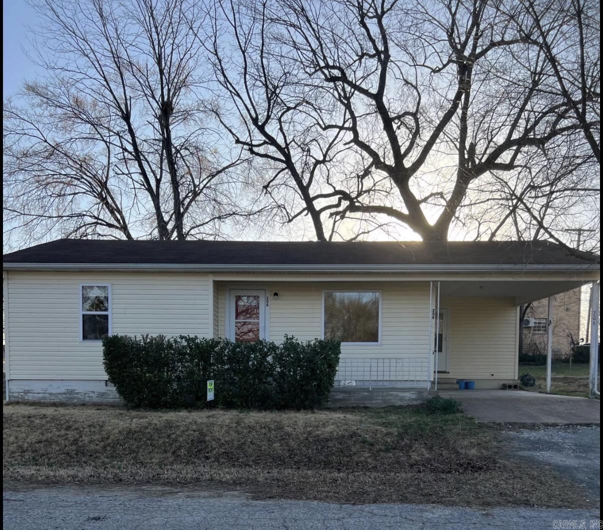 Perfect location and an excellent investment opportunity! Tenant already in place at $800 per month, providing immediate rental income. This charming 2-bedroom, 1-bath home features beautiful hardwood floors, a carport, and a storage shed. Conveniently located directly across from Flippin Middle School, this property is ideal for investors, first-time buyers, or anyone seeking a home in a prime location.