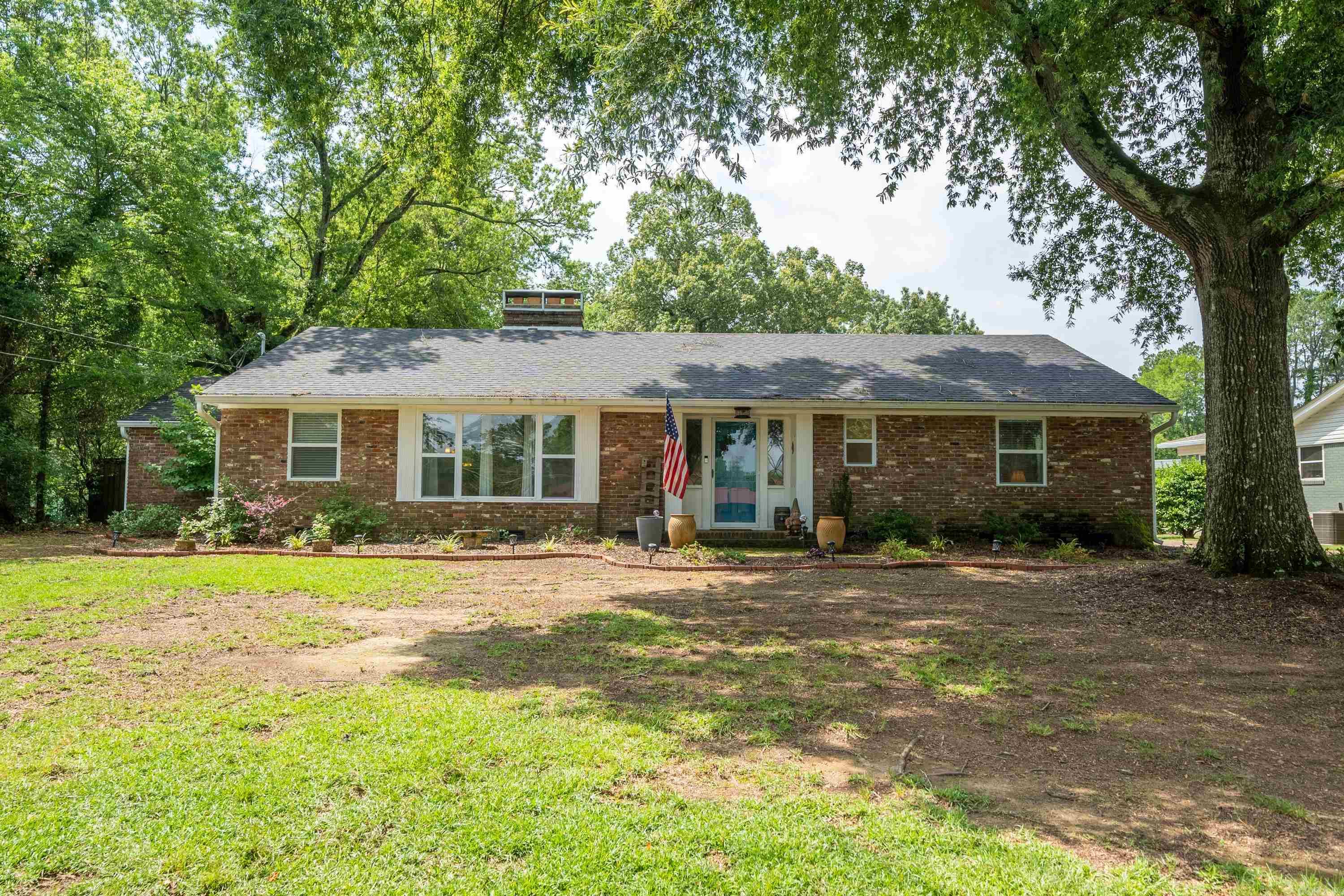 Check this out! Beautiful home in the heart of Hot Springs, Arkansas. This 3 bedroom, 2 bath features original hardwood floors, a fully fenced backyard, bonus room and updated kitchen. The home sits on a large level lot with a outdoor area for entertaining, mature trees, garage and a three car carport. In Lakeside School Districts and conveniently located close to the Hot Springs County Club, National Park Medical Center and historic downtown Hot Springs.   You don't want to miss this!