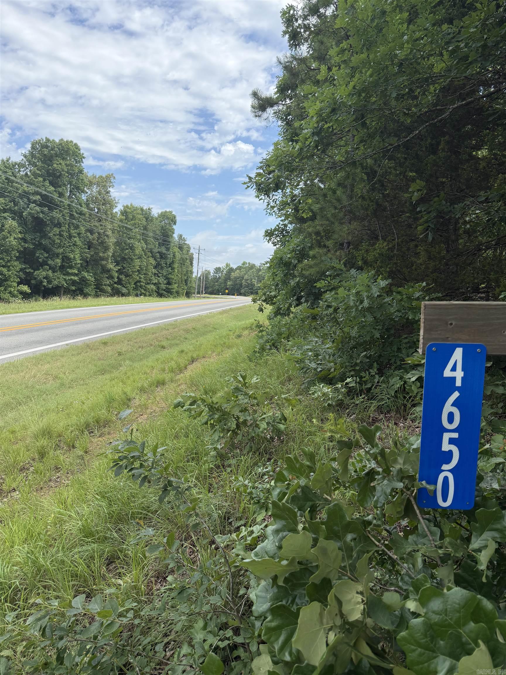 Ready to build that lake getaway or vacation rental tucked up in the woods? This property might just do the trick. Land has some initial clear spots to get your project going and possibilities galore. It has passed a perc test and that is on file with the county. ONLY 8 minutes to Lacy's Marina and the Narrows Boat Ramp on beautiful Greers Ferry Lake. Highway frontage-fronts Edgemont road (Hwy 16). Seller does have information about getting a driveway put in. No sub division and only 1 neighbor, but a few restrictions will apply.  1.  No trailer, mobile home, camper, vehicle, or temporary building or structure of any kind shall be used for a residence, either temporarily or permanently, unless being used during the period of construction, not to exceed 12 months. 2.  No junk cars or other inoperable equipment shall be stored in view of the surrounding neighbors or public roadways. 3.  No single-family dwelling shall be permitted with less than 1,000 square feet of living space, exclusive of garage, porches, or storage area.