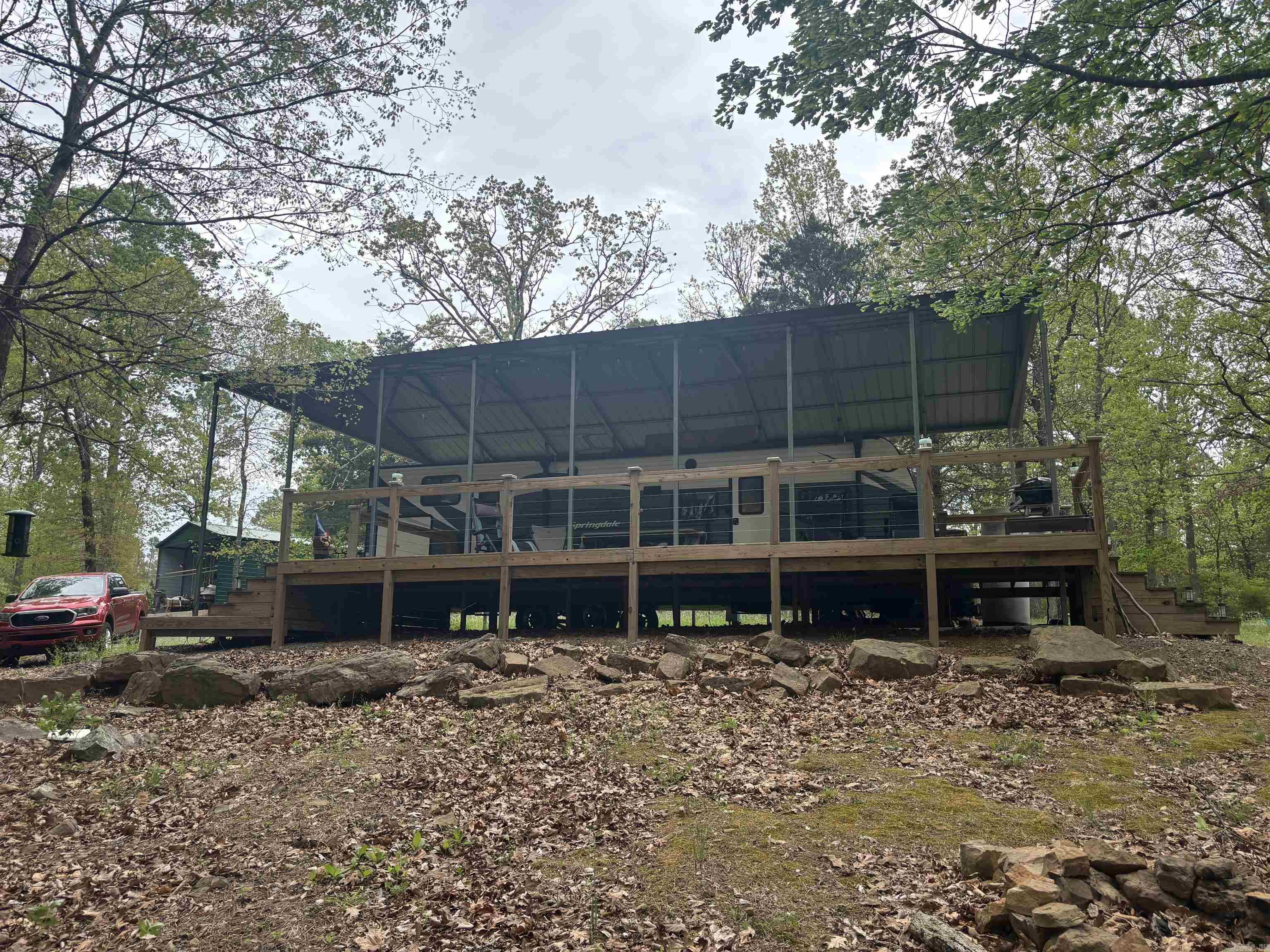 Lake front property on Greers Ferry. Has a remodeled RV trailer, deck, metal enclosure, utility shed, septic tank, gravel driveway, permitted path to lake, 2 jet skis, 1 golf cart, and 1 BOAT SLIP in the neighborhood marina. Will Co-Op 3% Rare find and will sell VERY fast at this price. Property address is 441 Cherokee Circle, Greers Ferry, AR, 72067.