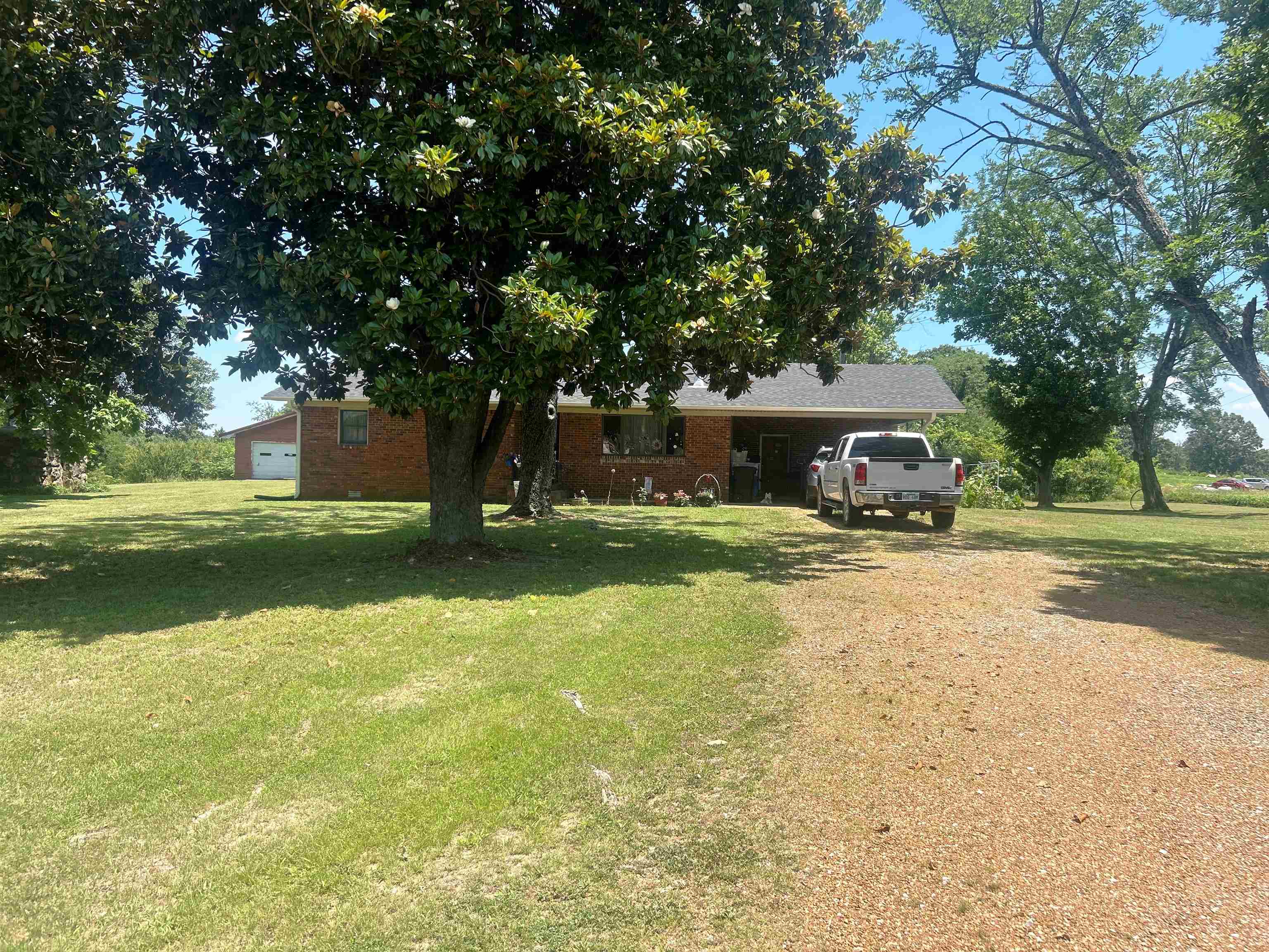 Charming country home on 2.88 acres in Glencoe, AR! Conveniently located between Ash Flat and Salem, this well-maintained 3BR 1BA brick home is the perfect fit for a starter home, retirement place, or anyone looking for room to spread out. The home offers an attached carport, patio, garden spots, and a nice level yard ideal for outdoor living. Need space for hobbies or storage? You’ll love the detached 20x30 shop with 13x10 lean-to. The property is on county water and also includes an older well. Major updates give peace of mind, including new roof in 2025, guttering in 2026, water heater in 2025, HVAC in 2021, wiring from pole to home in 2022, new gas cooktop in 2023, plus septic pumped and new field lines in 2023. If you’ve been looking for an affordable home with acreage in North Central Arkansas, this one offers country charm, convenience, and plenty of potential!