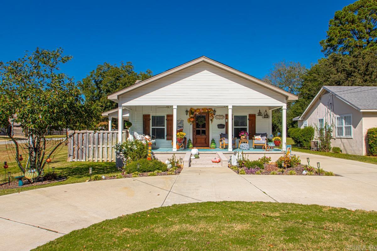 Welcome to this beautifully remodeled 3-bedroom, 2-bath home in the heart of downtown Benton, offering approximately 1,574 square feet of stylish and comfortable living space. Every inch of this home has been thoughtfully updated and tastefully decorated, blending modern finishes with timeless charm. You'll love the convenience of being just minutes from Benton's popular shops, local eateries, and all the best amenities-with easy access to Interstate 30 for effortless commuting. Outside, the property features a gated driveway as well as a welcoming circle drive, providing both security and curb appeal. In the back, you'll find a fantastic shop perfect for hobbies or storage, plus a charming she shed offering a private retreat or creative space. There is a simply spectacular covered patio in the back for drinking morning coffee and a glass of wine in the evening! This amazing home is a rare find in such a prime downtown location-move in ready and absolutely full of character! Don't miss your opportunity to own this beautiful home that has been well loved and cared for.  **AGENTS SEE REMARKS**