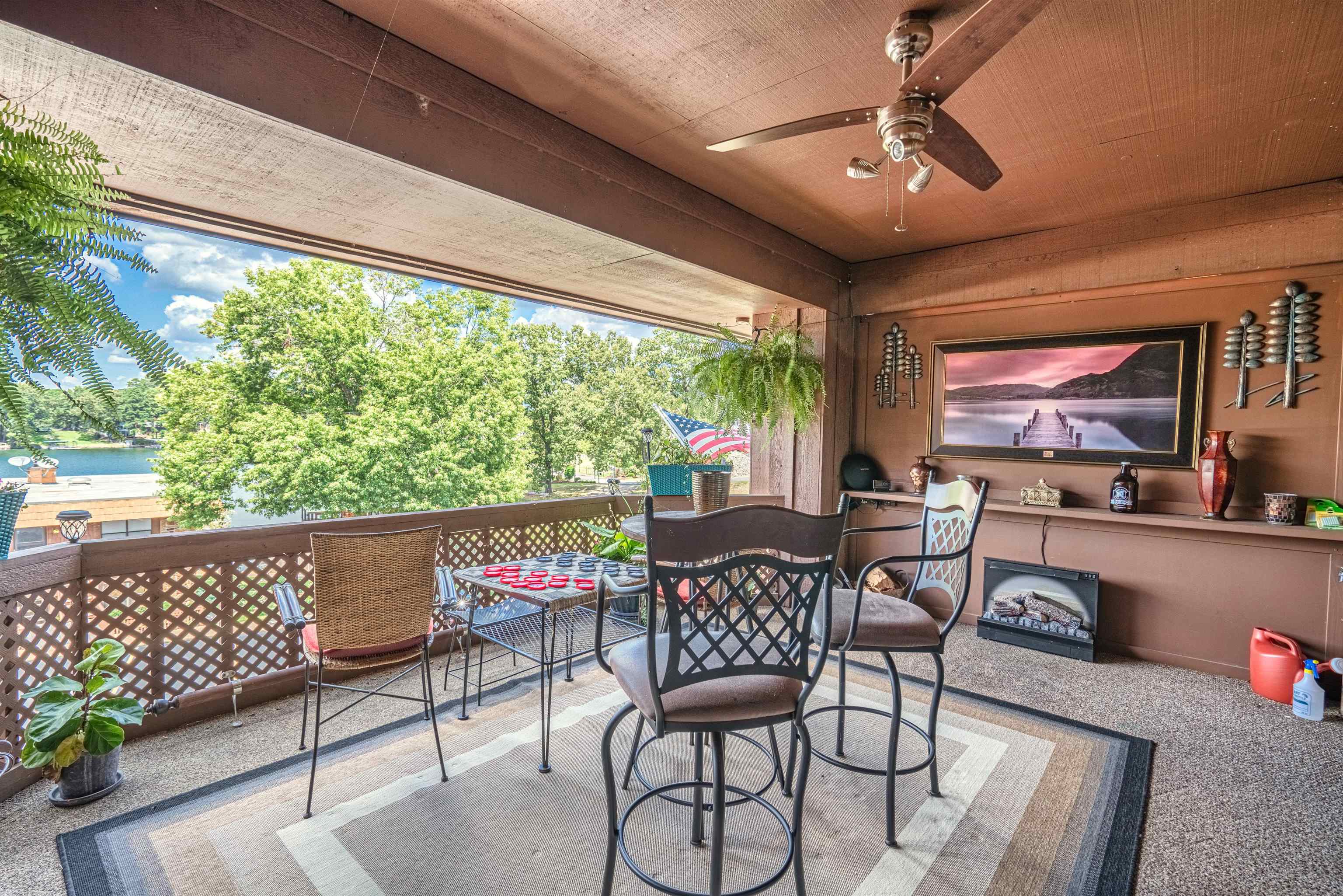 Looking for the perfect place to be on the lake!. This unit is a beautifully updated two bedroom condo sitting along a deep water cove just minutes from the main channel of Lake Hamilton in Hot Springs, Ar.  Enjoy pleasing perched lake views from your covered patio.  The ample dining area opens up to a warm and inviting living space with wood burning fireplace with plenty of room for entertaining!  Enjoy the lake views from the comfort of the master bedroom.  Gated and convenient to the pool too!