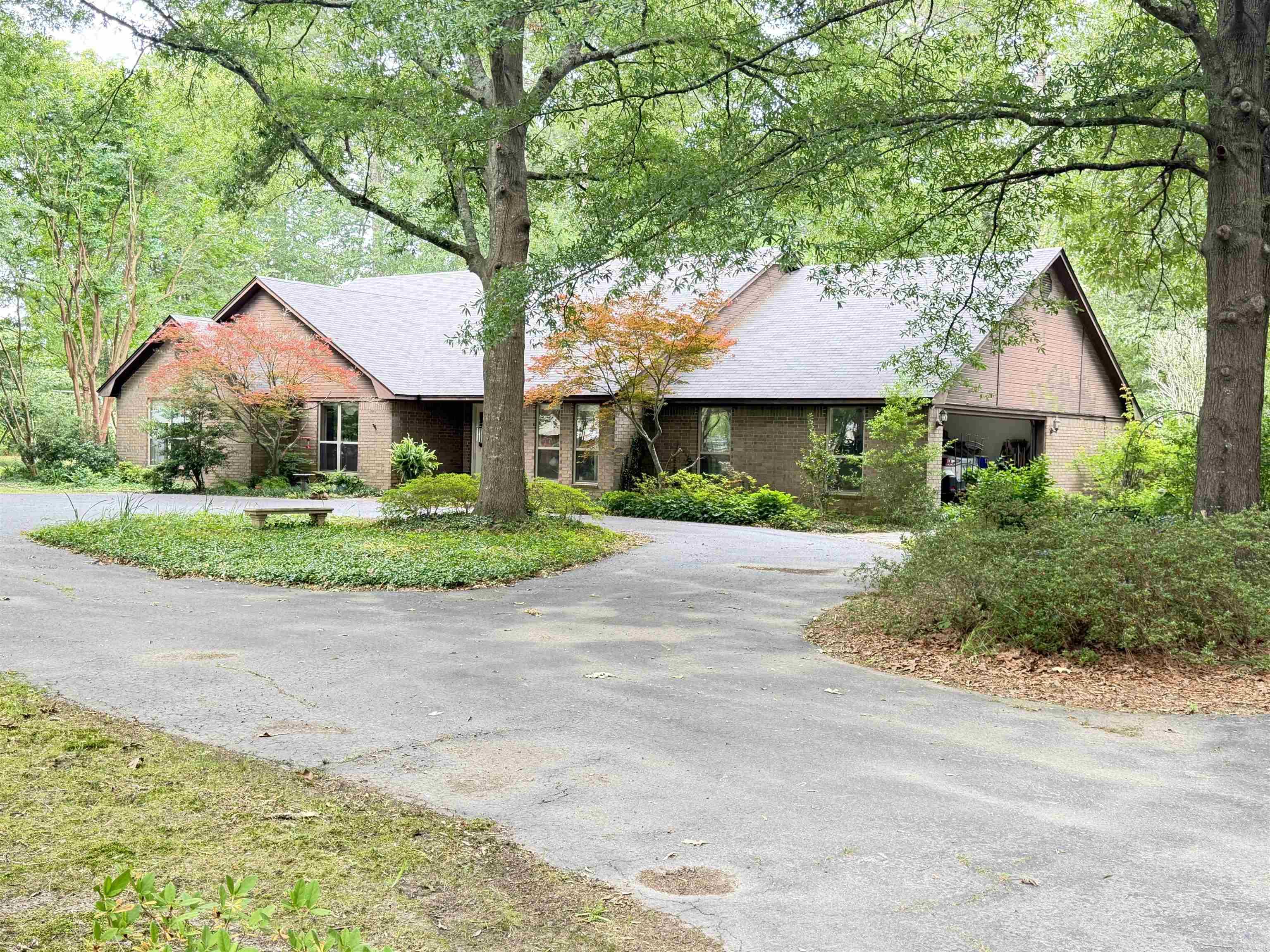 This charming three-bedroom, two-and-a-half-bath brick home offers the perfect blend of comfort, space, and privacy. Each bedroom is generously sized with ample closet space, while the large bathrooms provide plenty of room to relax and unwind. A convenient half bath adds extra functionality for guests. The kitchen is thoughtfully designed with efficiency in mind, featuring a pantry for added storage and easy organization. Just off the kitchen, a separate dining room creates the ideal setting for family meals or entertaining. The spacious living room serves as the heart of the home, complete with a cozy wood-burning stove that adds warmth and character. A beautiful entryway welcomes you in, setting the tone for the rest of the home. Additional features include a separate laundry room and a large walk-in storage area, ensuring everything has its place. Situated on ten  wooded, secluded acres, this property offers peace and privacy while still providing practical outdoor amenities. The 150x150 fenced backyard is perfect for pets, gardening, or outdoor gatherings, and a 20x30 shop provides excellent space for hobbies, equipment, or workspace needs. This is an ideal place to call home
