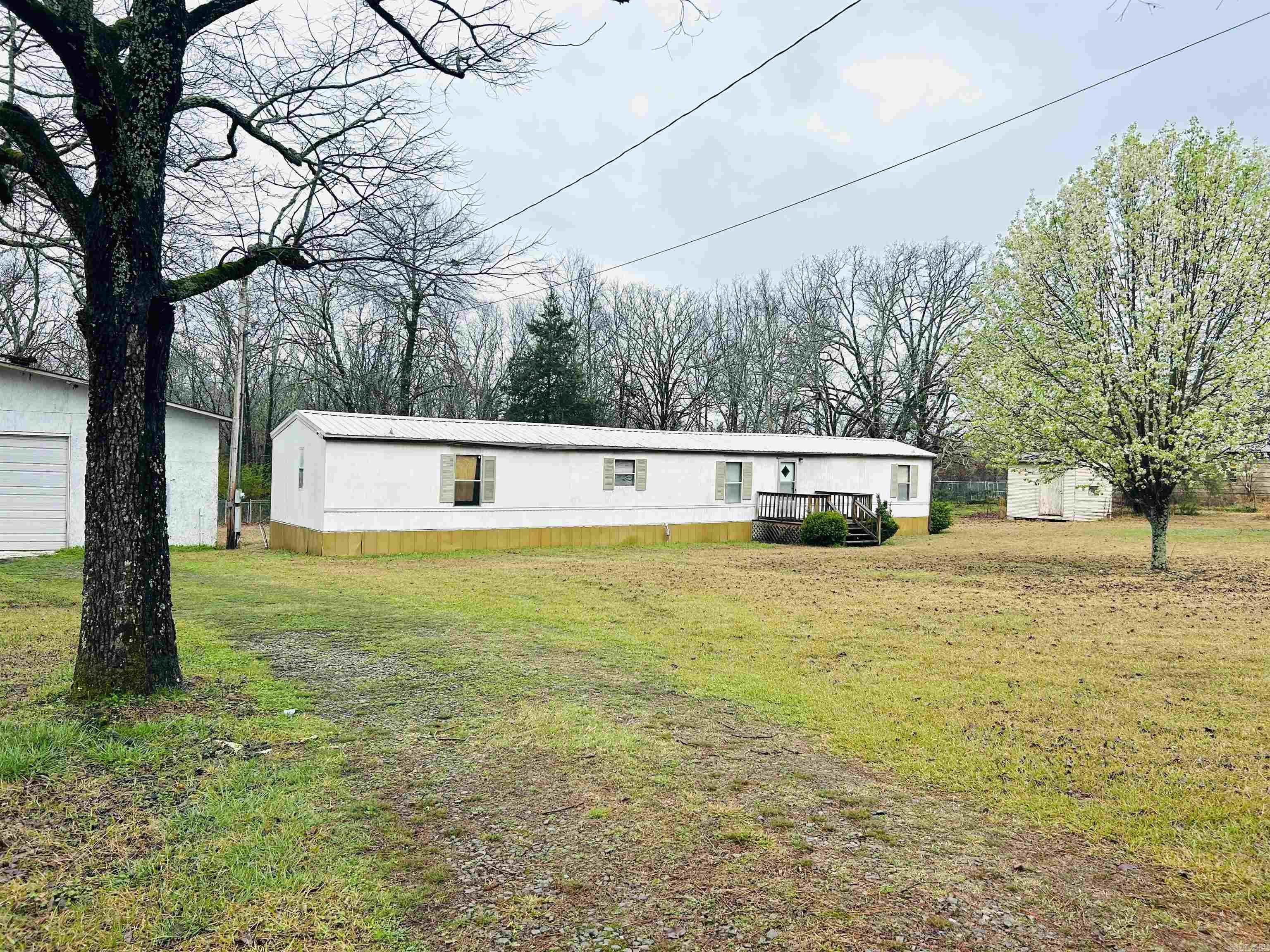 3 bedroom, 2 bathroom home situated on approximately 1 acre offering space and privacy. The interior features fresh paint and updated flooring, giving the home a clean and refreshed feel. The property also includes a large 60x40 wood-framed shop, providing plenty of room for storage, equipment, hobbies, or a workshop. With a great combination of indoor living space and functional outdoor features, this property offers a variety of possibilities for its next owner.