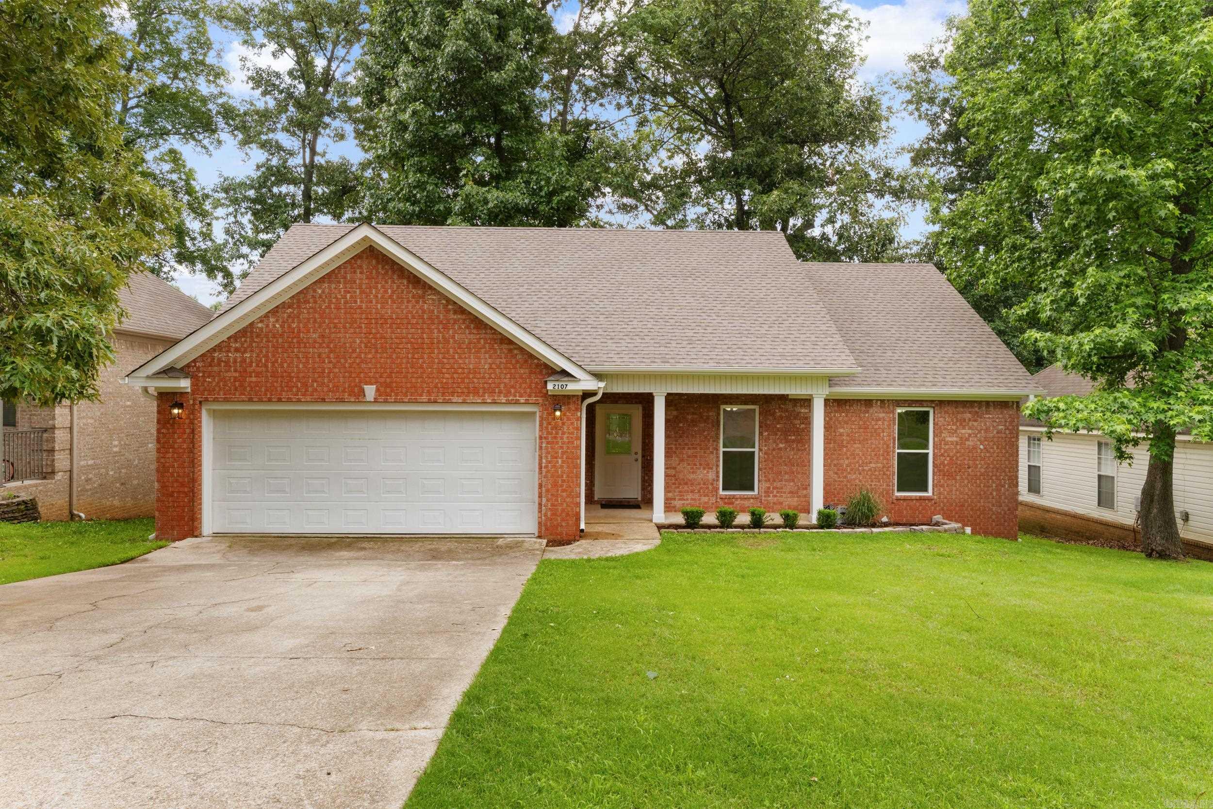 Newly remodeled and move-in ready! This beautiful home features a long list of updates, including a new roof, deck, carpet, luxury vinyl plank flooring, appliances, kitchen sink, plumbing fixtures, lighting, fresh paint throughout, and a new acrylic walk-in shower with glass door. The spacious Great Room with fireplace opens to a charming dining alcove and flows into the kitchen and breakfast area, complete with an eat-at peninsula, abundant counter space, and plenty of storage. A convenient computer nook just off the kitchen is perfect for work, study, or keeping an eye on daily activities. Enjoy outdoor living on the rear grilling porch, accessible from both the Great Room and breakfast area. The split-bedroom floor plan offers privacy, with two guest bedrooms and a hall bath on one side and a spacious primary suite on the other. The primary retreat features a boxed ceiling, dual vanities, soaking tub, walk-in shower, and dual walk-in closets. A nearby laundry room adds everyday convenience.