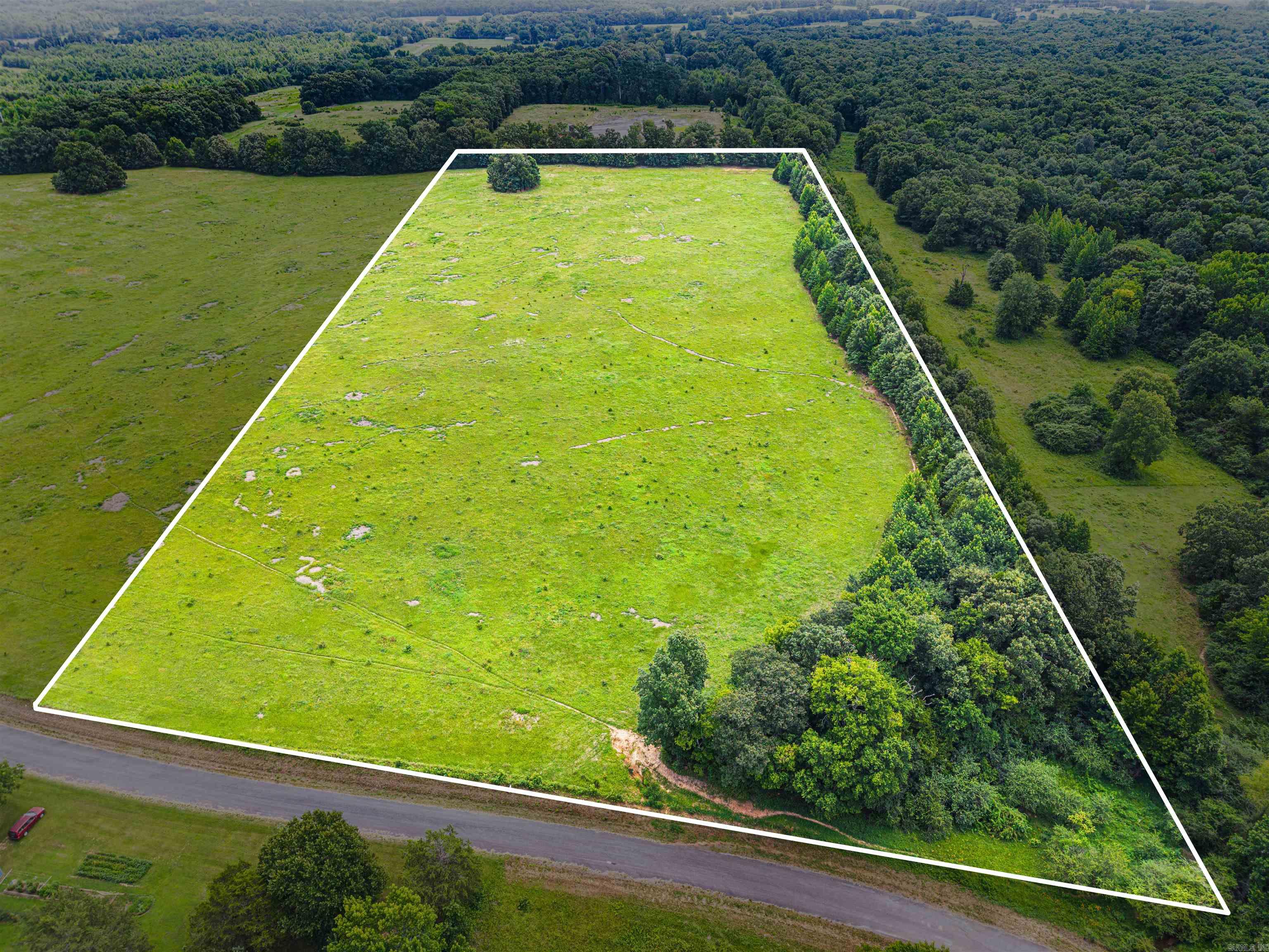 Looking for the perfect place to build? This beautiful unrestricted property offers the ideal blend of open pasture and mature timber, creating a balance of usable land and natural privacy. Whether you're dreaming of a custom home, barndominium, mini farm, or weekend retreat, the possibilities are wide open.  Enjoy the peaceful country setting, bring your animals, build what you want, and make it your own. If you've been searching for a homesite with room to spread out and the freedom to create your vision, this is the one. Mineral rights do not convey.  Can also be purchased with an additional 5.59 acres- See MLS number # 26026452.