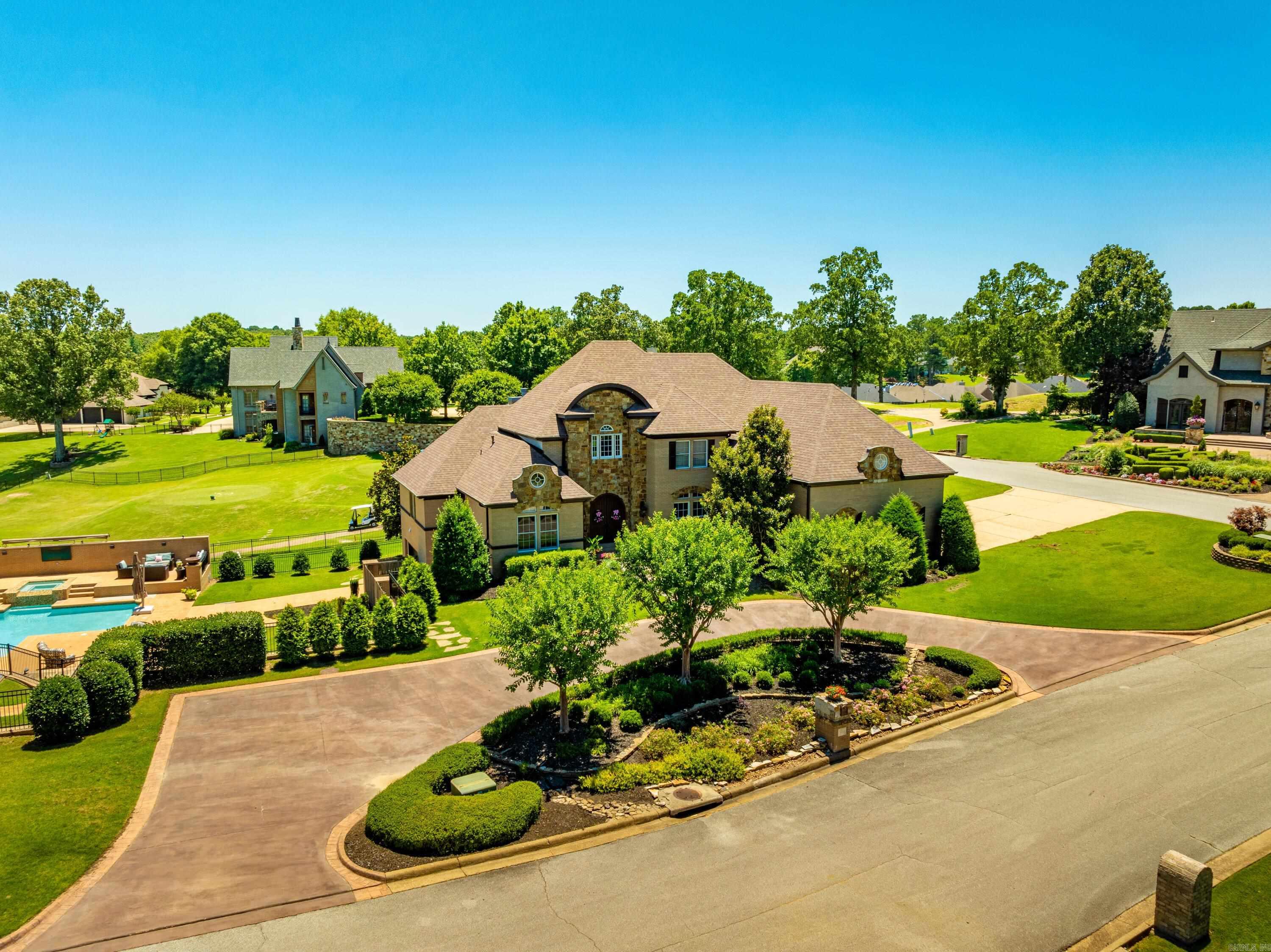 Custom home with over 7,900 sq ft +/- under roof, this home has an unground pool, hot tub, basket ball/pickle ball court, a lounge area great for entertaining along with rollup doors from the basement area where you have an entire grilling area! When you pull into the circle drive, you will enter through gorgeous double doors; upon entering the Foyer, you will be welcomed with high ceilings, lots of natural light, a magnificent staircase, and marble flooring.This home has so much to offer that it is a must see to appreciate.  On the main level you do have all you need from the master bedroom, kitchen, laundry, guest bedroom and bath, living room, sunroom, sitting room, and dining room.I will attach some documents that will give you more details on the home and the area!  I also will attach the floorplan and the map of the property.  I would love to show you this home and around the area.
