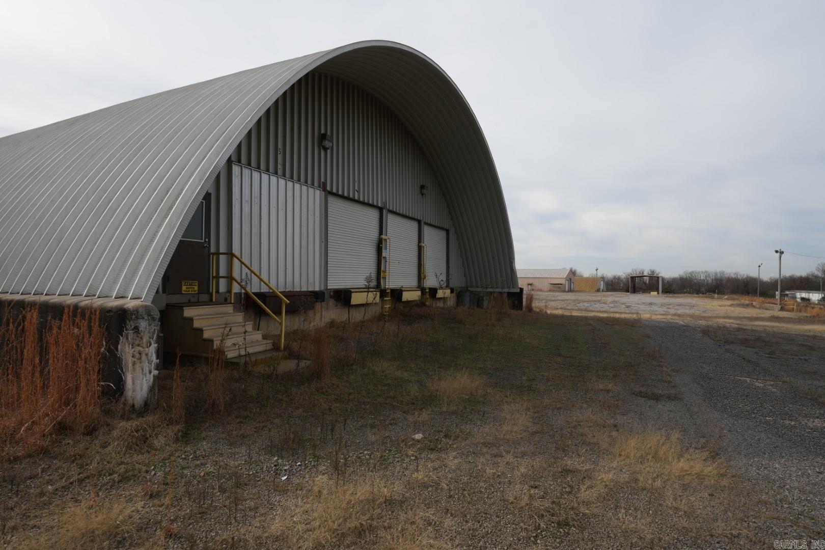 Prime commercial opportunity on approximately 4.8 acres with an existing building just one minute from I-40 and Russellville commercial. Zoned C-2 and C-5, this versatile property can accommodate a wide range of business uses—ideal for industrial, retail, service, or mixed-use development. The site offers excellent access and visibility along Bradley Cove Rd, with utilities on site and ample room for expansion or additional structures. Whether you’re an owner-operator seeking functional facilities or an investor looking for a high-growth corridor near businesses and major highways, this property delivers location, flexibility, and long-term potential.