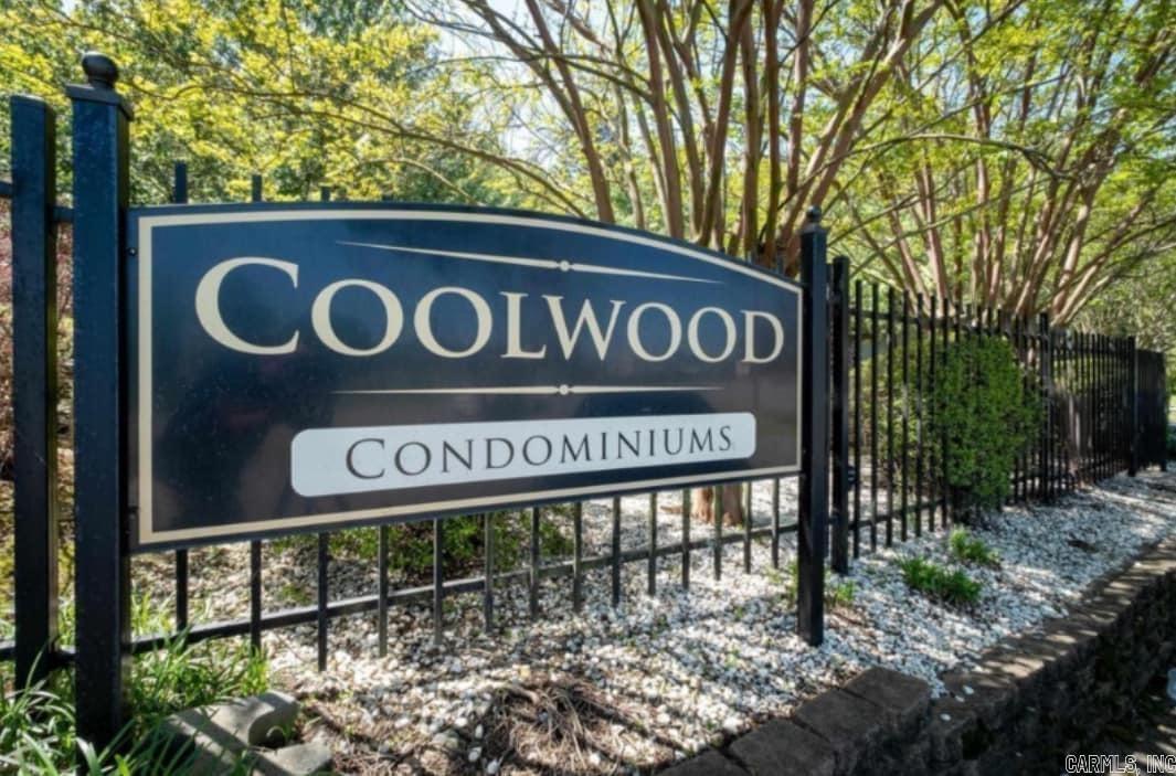 Welcome to this 2 bedroom, 1 bathroom condo in the desirable Coolwood Condo community, conveniently located just off Cantrell Road. The unit features wood and tile flooring throughout and slab granite countertops in both the kitchen and bathroom for a clean, modern look.  The kitchen comes fully equipped with all appliances, and a washer and dryer are included, conveniently tucked into a bathroom closet. Low utility costs with only electric and cold water billed to the owner—no gas, while the HOA covers hot water and trash service.   Enjoy your private deck overlooking the pool and beautifully landscaped grounds. The property also offers assigned covered parking located at the rear of the complex, all within a fully gated community.  Ideally situated near restaurants, shopping, biking trails, and downtown, this condo offers both comfort and convenience in a prime location. 10 units can be purchased as a package. AGENTS SEE REMARKS.