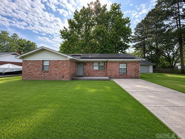 Great starter home! This charming brick home offers 3 bedrooms 1 bath and approx. 1,293 sq. ft. of comfortable living space. Recent updates include kitchen cabinets, fresh paint, light fixtures, laminate flooring & roof. Outside, you'll find a spacious 30x40 shop with electricity ~ perfect for a man cave, workshop, hobbies or additional storage. Don't miss this opportunity!! ****AGENTS SEE REMARKS****  **** Solar panels do not convey****shop has full bath but is not hooked to water/sewer.