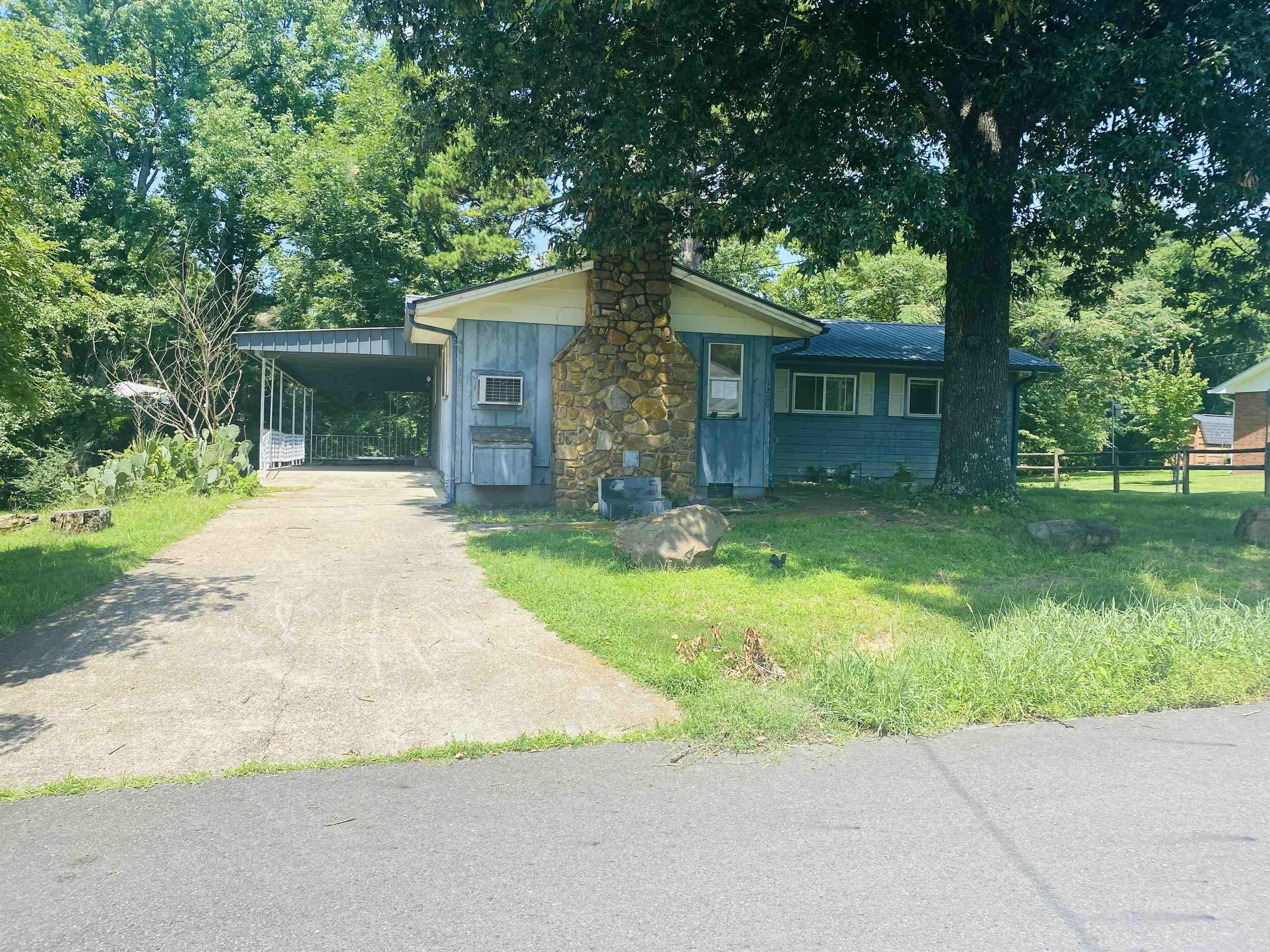 In town living with country charm feel! This 2-level home has so much going for it. The open living space with cedar walls, ceilings and floors and massive fireplace opens up to the large dining area that has patio doors opening up to the large balcony porch. Kitchen has built in gas stovetop on a large island. Double wall ovens and lots of cabinet space in the kitchen. Upper level contains 2 bedrooms, 1 1/2 baths and 1 bedroom has a dressing area. Lower level contains bath, bedroom and laundry room with another room that can be an office, study or game room. Connected to the home is also a two-room storage room. Case Number #031-490272 HUD homes are Sold As Is www.olympusams-at.com www.HudHomeStore.gov