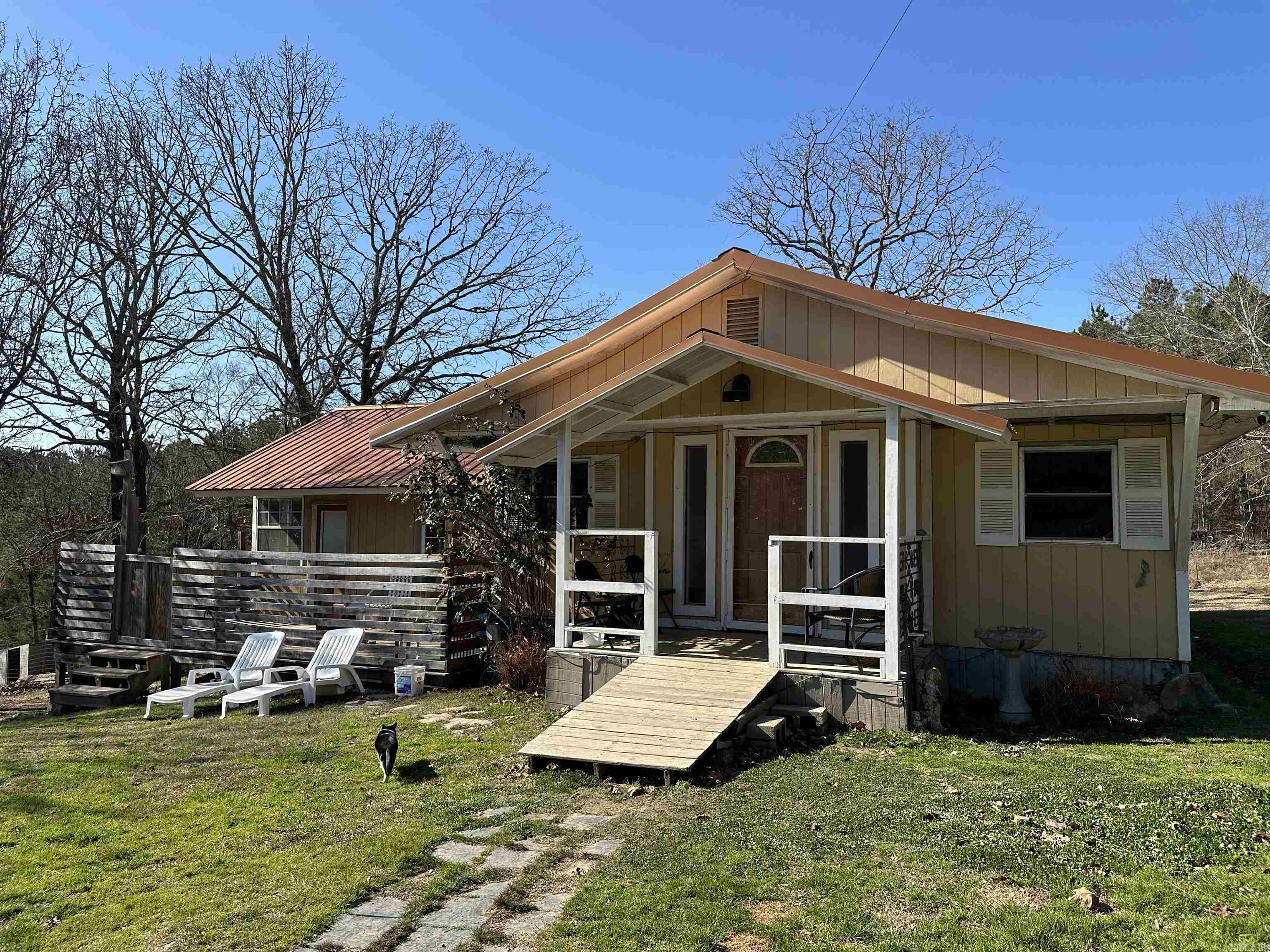 Being sold as a package: 598 Timberlake Drive (Parcel ID: 100-18517-000) & 600 Timberlake Drive (Parcel ID:100-18517-002). Approx. 5 acres in the Lake Hamilton School District with a cozy 3 or 4 bedroom 2 bath one-level country home. Metal roof, central heat/air, and outdoor features including a deck/patio, partially fenced area, dog run, and outside boat or RV storage building—set in a peaceful rural setting. Mobile home comes with at no added value.