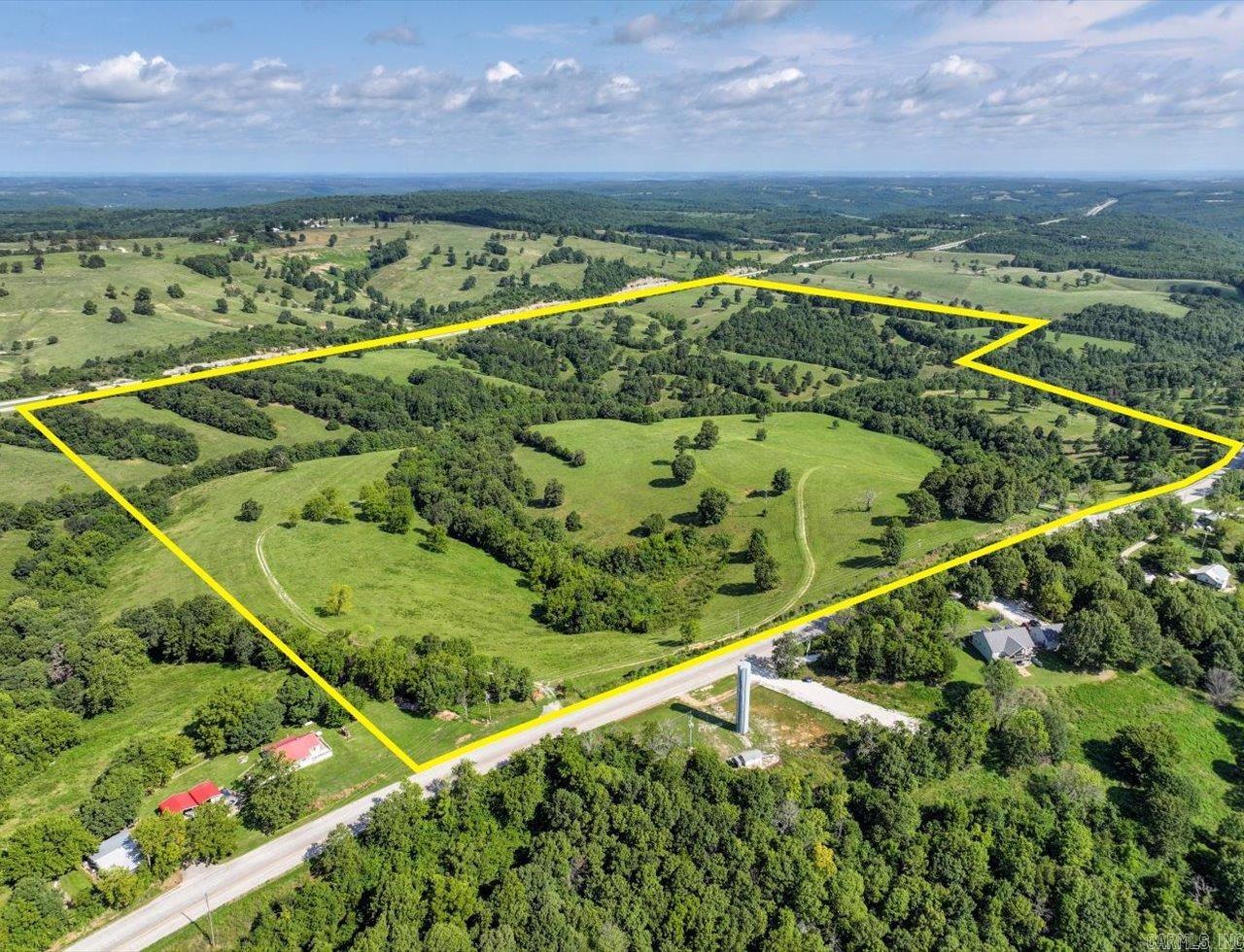 Located close to the Missouri Border. Rolling pastures and Hwy 65 frontage. Utilities in place or proposed subdivision. Rolling hills and vista views. Two entry points to Old Hwy 65.  Large scale residential development opportunity. 3+ acre lots pre-plated. Utilities including water ran through property or home sites. Minutes from Branson.