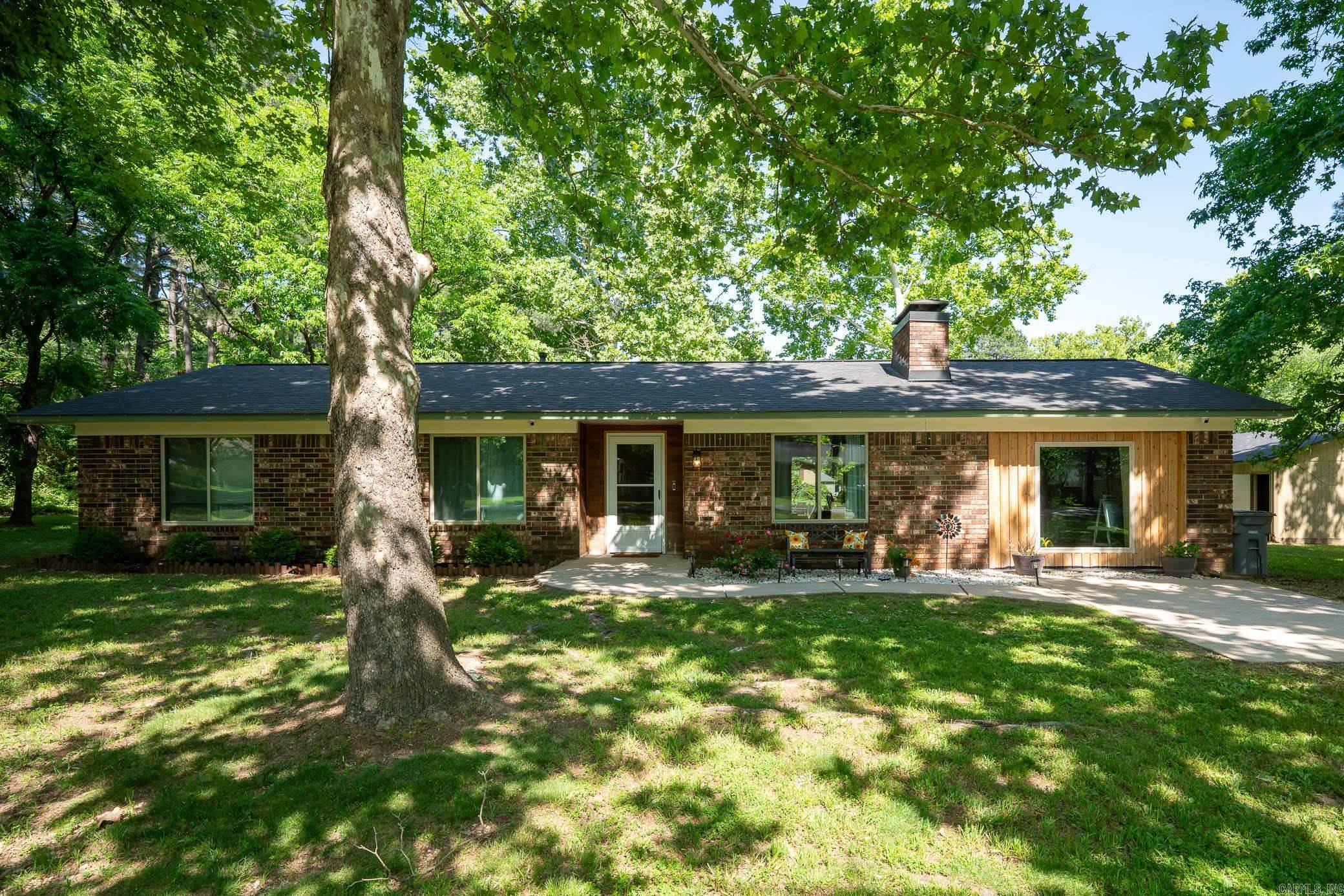 Enjoy the perfect blend of comfort and country living in this charming 3BR/2BA home situated on a large corner lot. Featuring an open floor plan with durable LVP flooring and tile, this home offers both style and functionality. The cozy eat-in kitchen is perfect for gathering with family and friends, while the bonus room provides flexible space for a home office, playroom, or second living area. Step outside to the large patio, ideal for outdoor entertaining, relaxing evenings, and making memories with family. Nestled between Conway & Vilonia, this move-in ready home, just minutes from shopping, dining and I-40, is the perfect balance of convenience and peaceful living. It has been exceptionally well maintained with numerous updates, including insulated windows and doors, new septic system, hot water heater, and fireplace insert in 2023, along with a new roof and HVAC in 2020. The property also includes a large storage building with electricity, offering the perfect space for a workshop, extra storage, hobbies, or additional parking. Combining comfort, charm, and major updates, this home is ready for the next owners to enjoy!  It won’t last long, schedule your showing today!