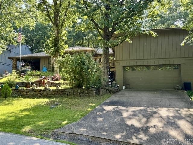 This property is in the heart of Fairfield Bay! 3 bedrooms with 3 full bathrooms on main level.  Large room can be used as an office or dining room as well as a finished room in the basement with side door access and access to the 2 car garage.  Great extra space that is private from the rest of the house.  Fenced back yard with covered patio and ceiling fan.  A perfect place to start your day or relax in the evenings. Additional large patio off the front porch as well.  The possibilities are endless for this must see property!