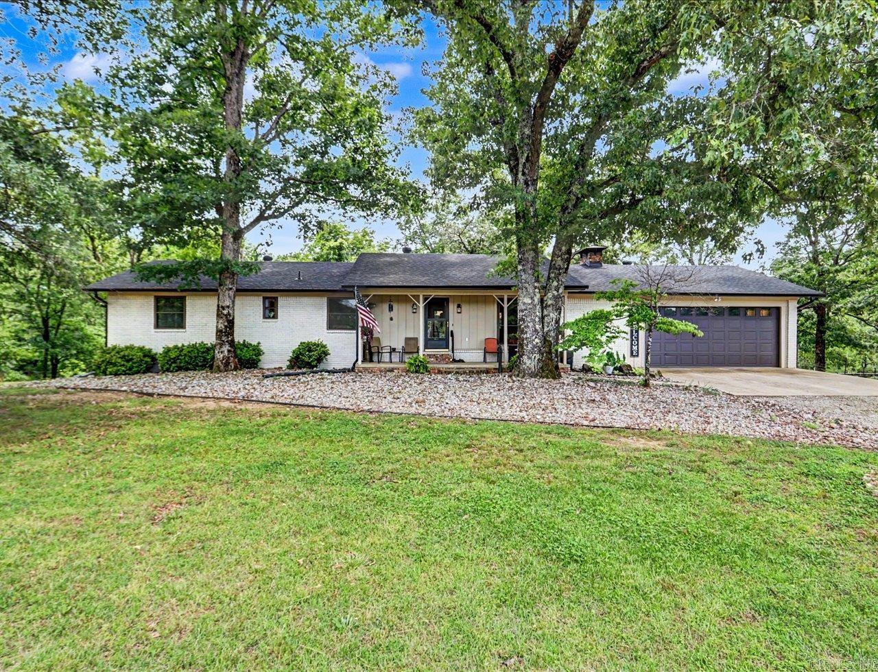 Nestled on 5 beautiful acres along scenic Cearley Creek, this updated brick home offers the perfect blend of country charm, outdoor living, and convenience — all just minutes from Hot Springs and Lake Ouachita. Originally built to last and thoughtfully upgraded over the years, the property now features inviting outdoor spaces designed to take full advantage of the peaceful creekside setting.   Enjoy mornings overlooking the water from the newly added gazebo and expansive outdoor living area, or spend afternoons fishing, swimming, and relaxing at your own private swimming hole along the creek. The fully fenced acreage is ideal for hobby farming, horses, cattle, or simply enjoying room to roam, with a small barn, chicken coop, raised garden beds, and irrigation already in place for those looking to embrace country living.  Inside, the updated home offers comfortable living with modern improvements while maintaining its solid, timeless character. The spacious property provides plenty of room for expansion, additional outbuildings, or future improvements to fit your vision.  Hobby farm or private retreat close to Lake Ouachita and all that Hot Springs has to offer