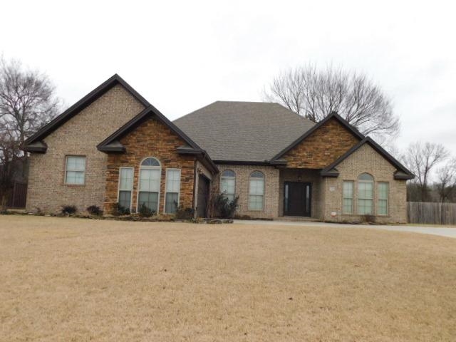 Open split floor plan with extra crown molding. Kitchen features granite counter tops, stainless appliances, gas cook top, and walk in pantry. Over sized master bedroom has private door to covered patio.Master bath with double closets, soaker tub, and walk in shower. Jack and Jill bathroom separate bedrooms 3 & 4.