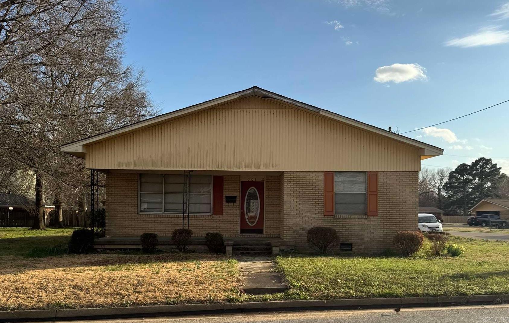 Spacious 3 bedroom, 2 bath brick home featuring a nice front porch and plenty of character. This home offers generous living space and great potential for someone ready to make it their own.