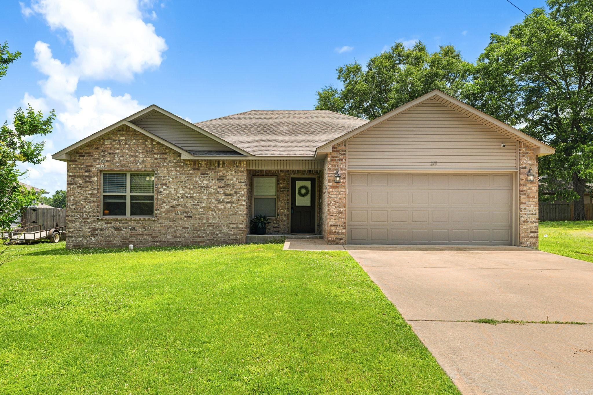 PCSing to Little Rock? Welcome home! Located in Ward with an easy commute to Little Rock Air Force Base, 253 Brewer Street offers the space, storage, and backyard you are looking for. Step inside to find a spacious living room with a soaring vaulted ceiling, crown molding, and an open feel that makes the home feel even larger. The kitchen features stainless steel appliances, a farmhouse sink, and charming accents, creating a space that's both functional and inviting. The thoughtful floor plan offers room to spread out, while the fully fenced backyard provides plenty of space for kids, dogs, backyard barbecues, or simply unwinding after a long day. One of the hidden gems of this neighborhood is the nearby pond, just a short walk away. Grab a fishing pole, take an evening stroll, or enjoy a slower pace of life while still being conveniently located near everything you need. Whether you're arriving for your next assignment or simply looking for a place that feels like home, 253 Brewer Street is ready for its next chapter.