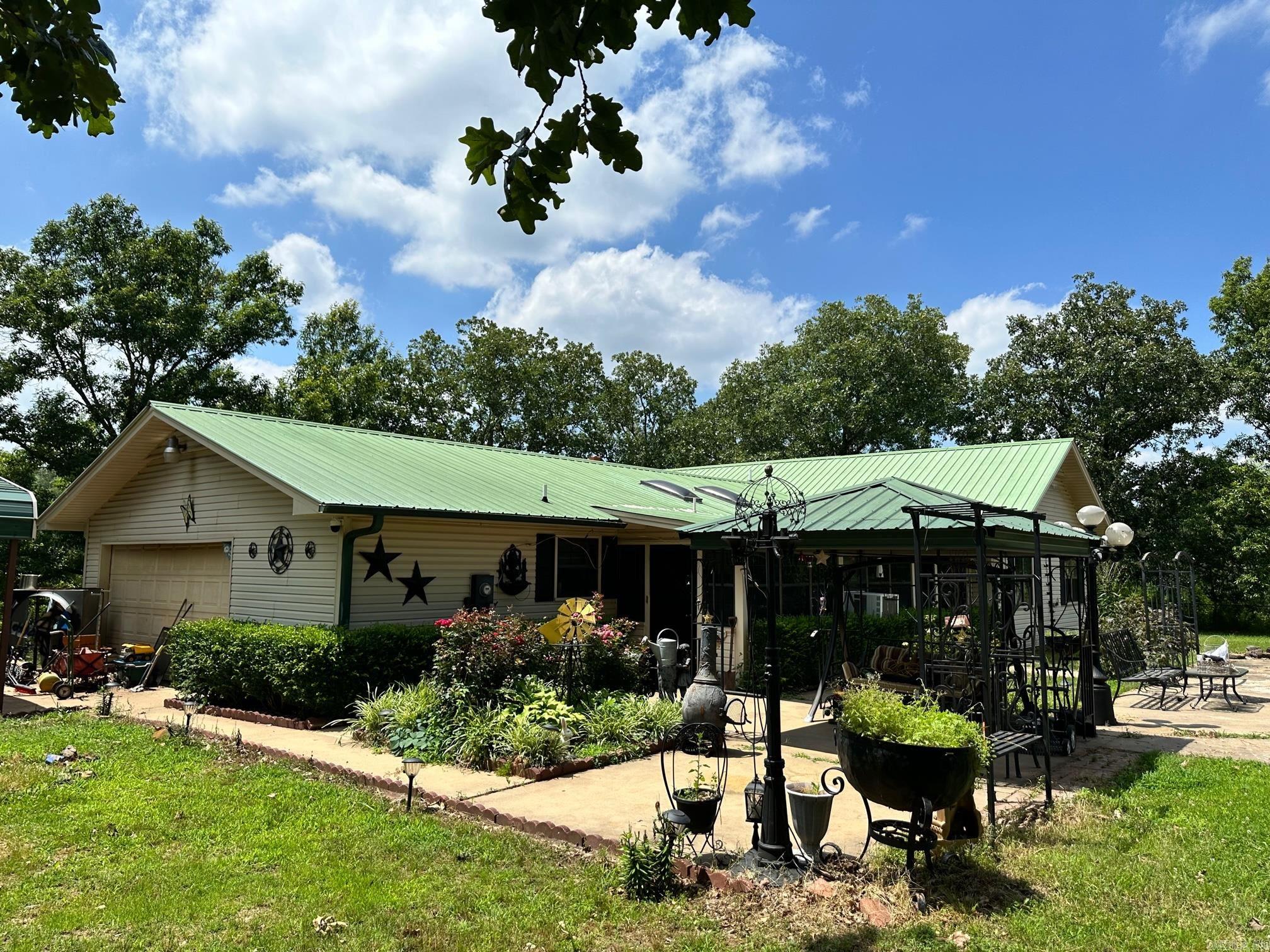 THIS PROPERTY IS A DIAMOND IN THE ROUGH!!! With a little TLC and updating this property could be brought back to life! Views of the mountains and secluded living is what it's all about. This nearly 2,700 sq.ft. home sits on 19.52 acres and has so much to offer! Super large kitchen w/ skylights, large bedrooms and massive living area with cathedral ceilings, rock fireplace, built-in bookshelves, hardwood floors, etc. Large main bedroom has vaulted ceilings, a private sitting porch. The large main bathroom features a garden tub, skylights, vanity and a walk-in shower. Enjoy your morning coffee in the large sunroom that overlooks the inground pool. The property has 2 large barn type sheds that are perfect for farm equipment, etc. There is additional septic for another home!!