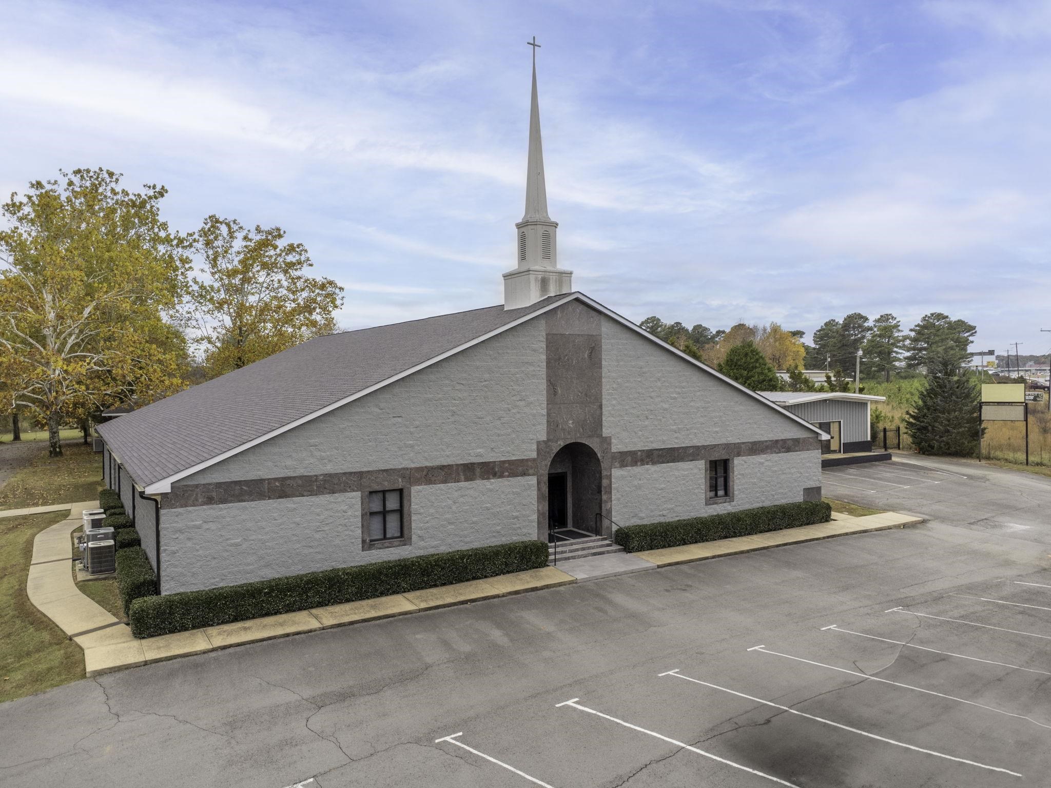 Welcome to a move-in church located in the HEART of Saline County. High visibility on I-30, recently rezoned to C-3. This campus includes a total building square footage is 13,929 sq ft.The three buildings encompass the main sanctuary, youth center with a guest apartment,& fellowship building sitting on a little over 2 acres.The glass front doors open to the foyer.Through the foyer, you will find the sanctuary, pulpit, baptistry, changing area, & choir seating.The sanctuary has a vaulted ceiling with acoustical ceiling panels. Restrooms,2 offices, and 7 classrooms are all located around the sanctuary.The stairway gives access 2nd-floor control room.The Children's center is 3,085 sq ft.This includes the main worship area, offices, 2 bathrooms & the newest addition;a guest apartment, & youth activity This area has a kitchenette and 1.5 bathrooms.  The Fellowship Center is an open floor plan with 1.5 baths and with large kitchen space perfect for gatherings includes a breezeway & garage.