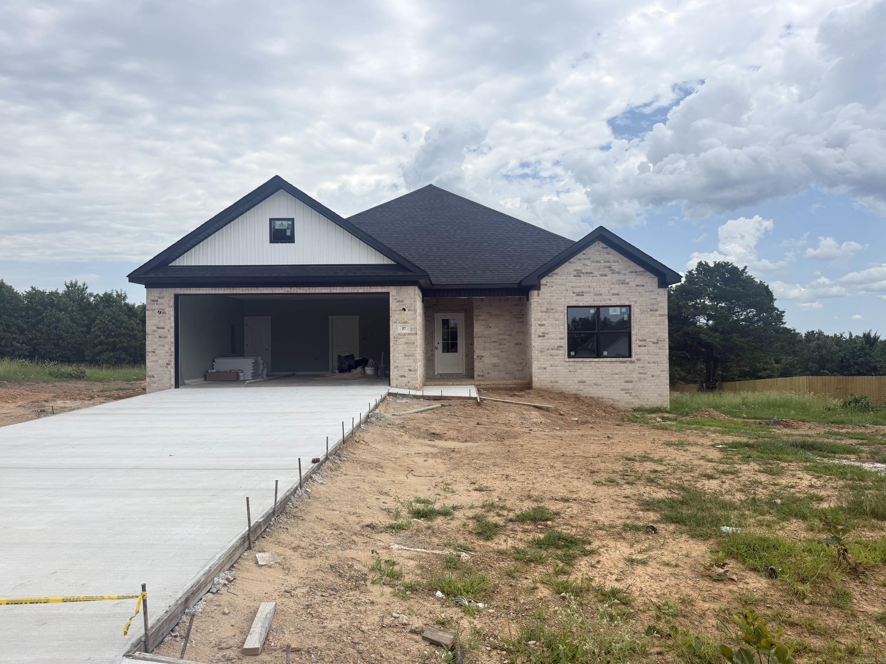 Under Construction – Your Brand-New Dream Home Awaits! This beautifully crafted 3-bedroom, 2-bath home offers 1,754 square feet of thoughtfully designed living space on a spacious 1-acre lot. The open-concept floor plan features a vaulted living room that flows seamlessly into the kitchen, complete with a large center island, custom cabinetry, walk-in pantry, and stylish finishes throughout. The private primary suite includes a tray ceiling, generous walk-in closet, and a spa-inspired bath. Enjoy the peace and privacy of country living with plenty of outdoor space to make your own while still being close to modern conveniences. Quality craftsmanship and modern design come together in this new construction home that's nearing completion. Don't miss your opportunity to own a beautiful new home with room to breathe and all the benefits of brand-new construction!