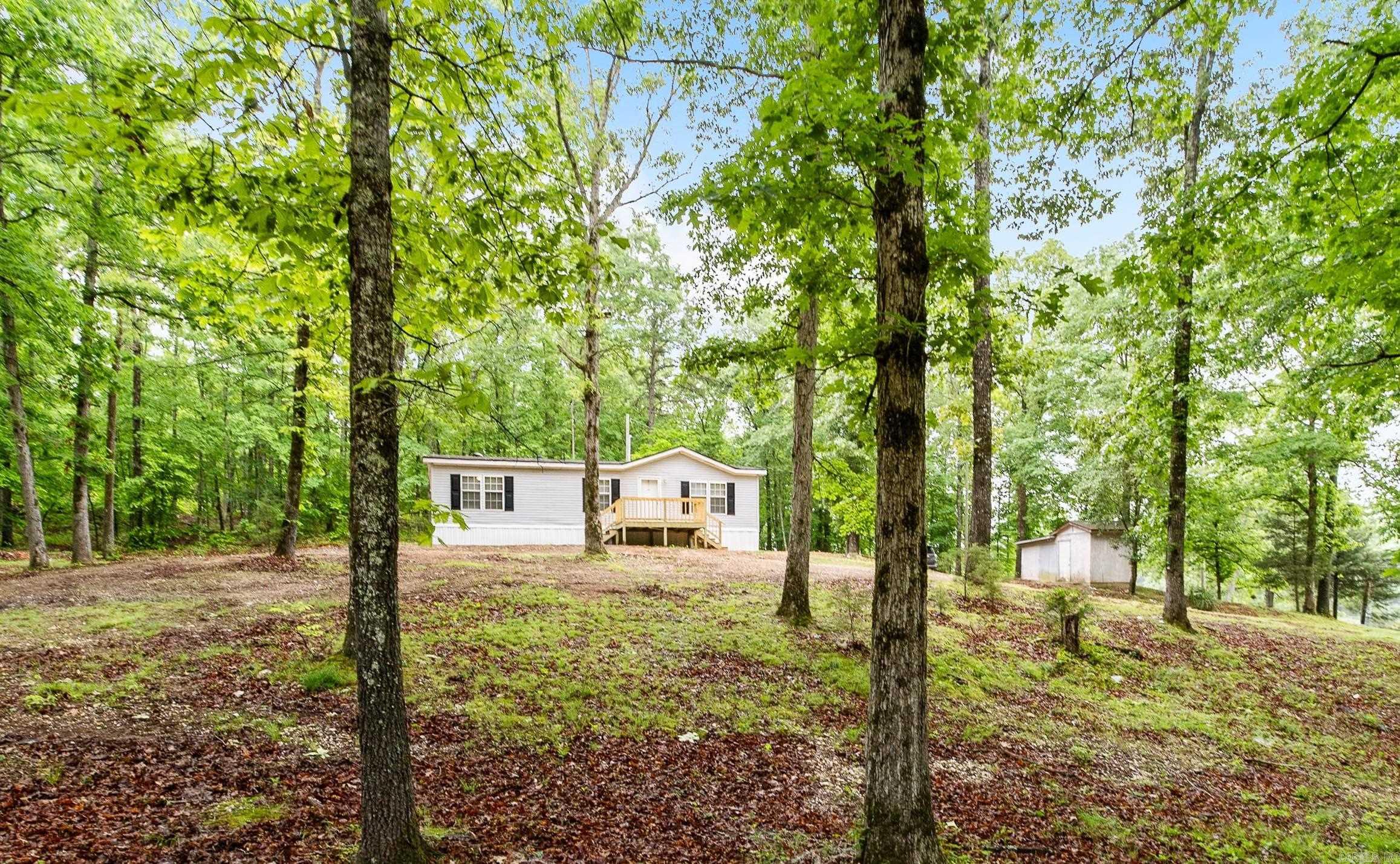 Peace, tranquility and room to grow! This 3.15 acre property has beautiful trees and a winding creek just waiting for you to enjoy. Sit on the newly built deck and enjoy nature in your private oasis. The cozy home is tucked away from the road, surrounded by natural beauty and has all new appliances, flooring and paint. Bryant schools, short drive to Saline County shopping and a gorgeous back-road commute to Little Rock. Fiber Optic Internet from Connect2First means this could be your home office. One-of-a-kind opportunities like this don't show up every day. Don't miss it! Some photos include virtual staging.