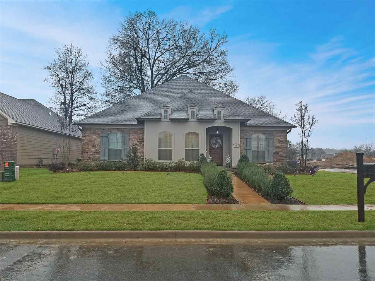 This exquisite 4BR home in SW Conway has too many upgrades to remember but just to name a few let's start with the amazing kitchen! Upgraded backsplash, custom cabinets, granite counters, upgraded gas stove. Also has custombuilt fireplace with custom trim, and custom lighting throughout. Master closet has custom storage.  The open plan makes this home great for entertaining with the living/kitchen/dining areas together.  Stained concrete floors, fenced yard, large corner lot, cover porch, side entry garage.