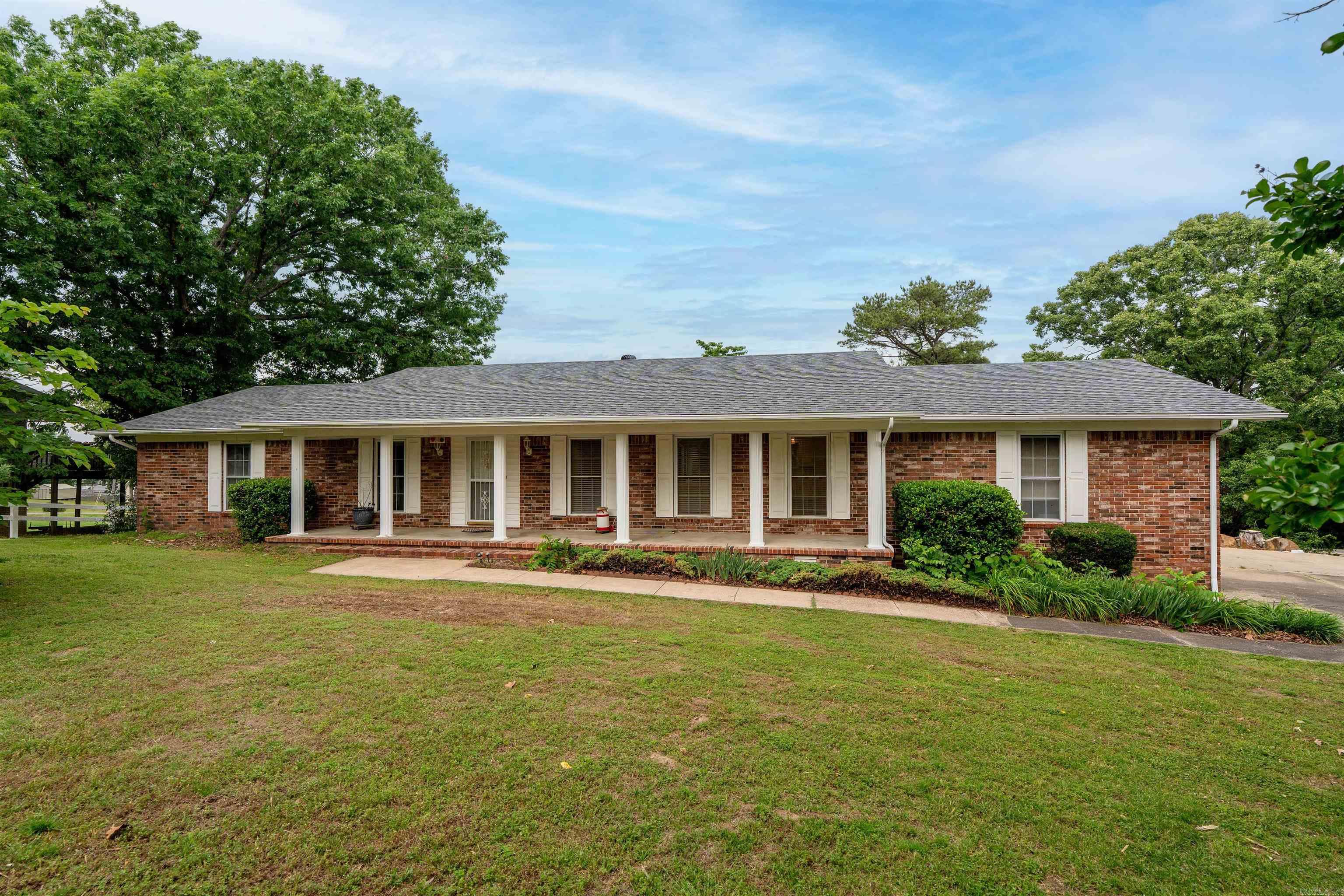 Beautifully updated brick home offering a light, open layout in a fantastic Heber Springs location! Recent renovations include walls removed to create an inviting open floor plan, new luxury vinyl flooring, quartz countertops, fresh paint throughout, new water heater, 98% efficient HVAC, new roof, and many more. The spacious living area features a cozy fireplace and flows seamlessly into the kitchen with an eat-in bar perfect for gathering with family and friends. The sunroom has been additionally heated and cooled, adding valuable extra living space to enjoy year round. A heated and cooled office space in the garage is perfect for working from home, hobbies, or a flex space. Below the home is a basement that is perfect for Arkansas storms and additional storage. Outside, you'll love the charming front porch along with two back decks overlooking the backyard, creating great spaces to relax and entertain. This well-maintained home offers a wonderful combination of updates, functionality, and charm! Tour today!!!