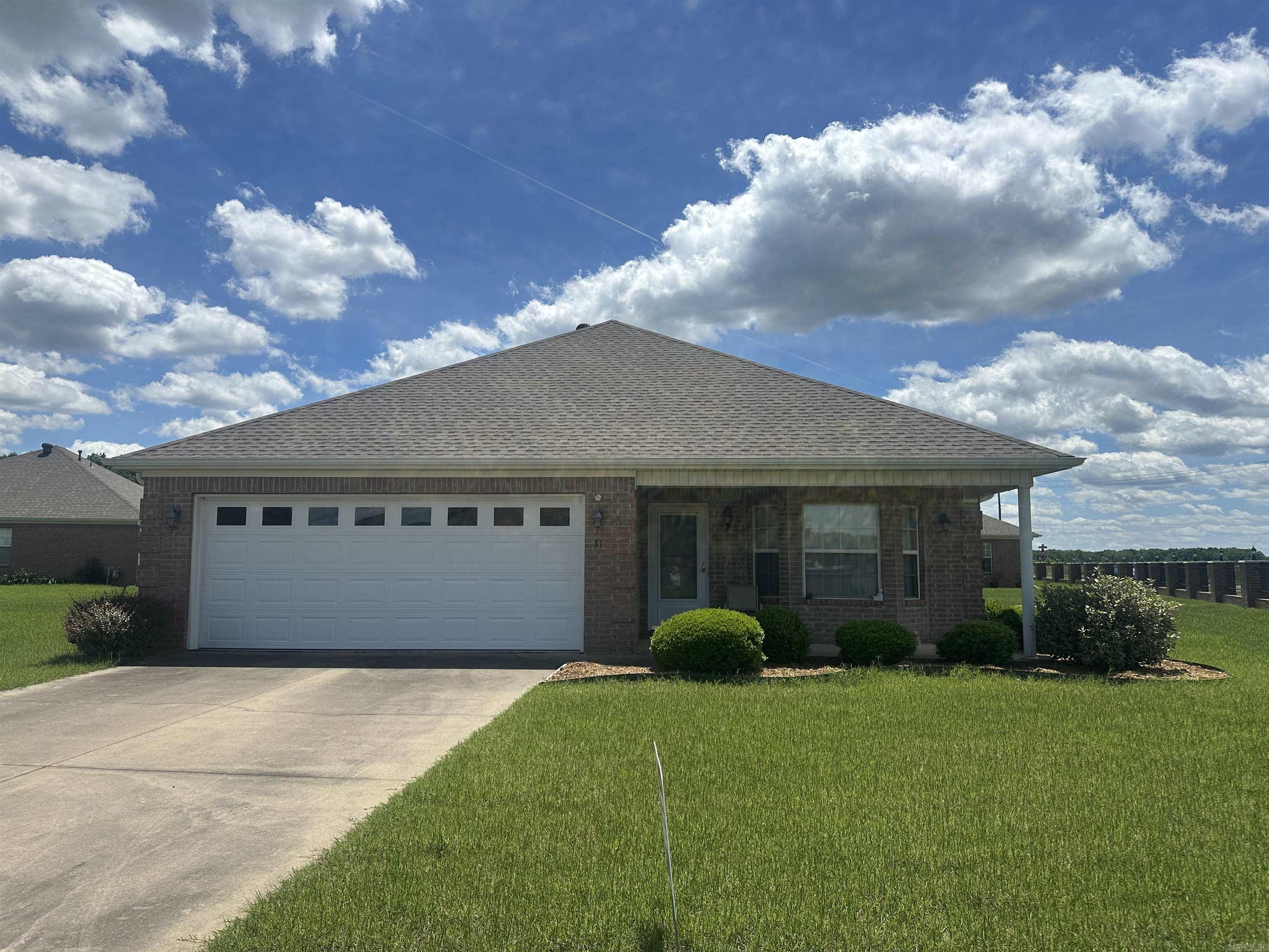 Immaculate home in gated subdivision in "over 55" neighborhood. POA takes care of your yard and the security gate.  Easy, comfortable setting with low maintenance  care. Yard sprinkler in yard.  Original owner also.  Refrigerator, washer and dryer stays.  Roof replaced in 2023, HVAC replaced 2020-21 and hot water heater about 2017.  Microwave and dishwasher have been updated. Corner gas log fireplace, tile flooring, also.  Master bath has handicap features with walk in shower. . Hall bathroom has jetted tub/shower.  See agent notes