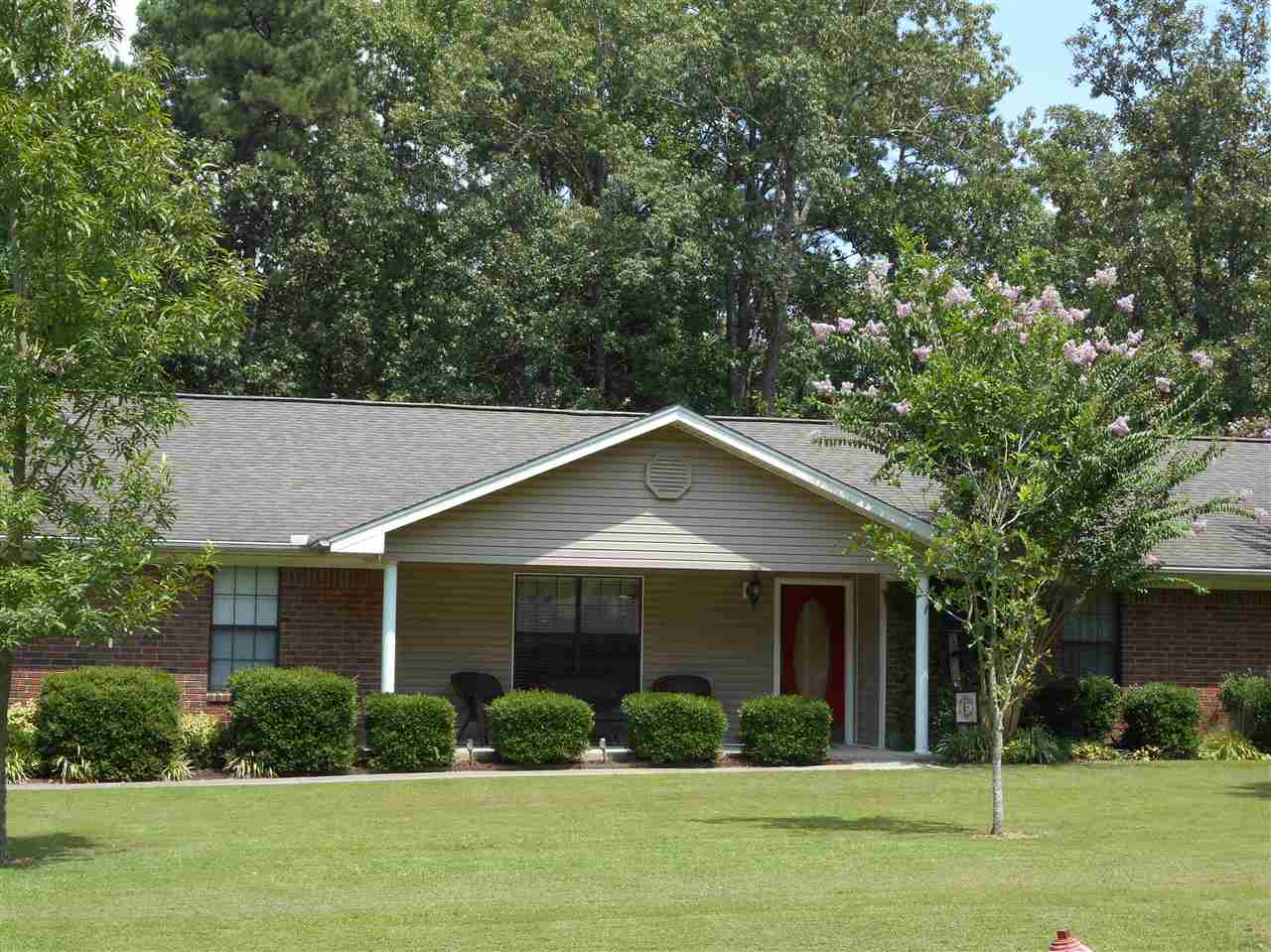 4 BRs (MBR separated). 3.5 Baths (1/2 accessible to pool area). Nice house with in ground swimming pool plus attractive water feature. Storage area w/chain link dog area. Covered patio. Kitchen with stainless & black appliances. Gas range. Nice tile counter tops, eat at bar and space for table/chairs.  Lg laundry room.  Living room plus a big den. Taxes $2,282.82. Built 1996.  White Hall and close to new water park. NEW ROOF 4-1-2016.