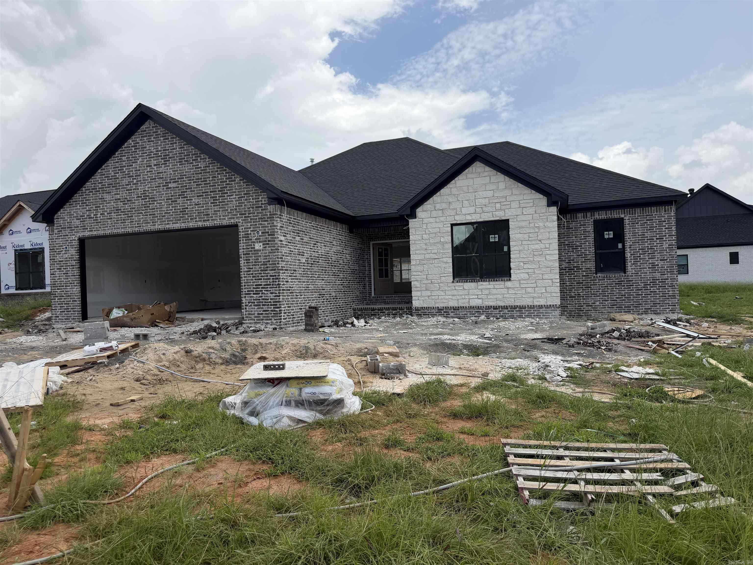 Experience the perfect blend of modern design and quality craftsmanship in this stunning new construction home featuring 4 bedrooms and 2 bathrooms. The open-concept floor plan creates a spacious, inviting atmosphere ideal for everyday living and entertaining. The living room is anchored by a breathtaking floor-to-ceiling rock fireplace accented with custom stained beams. The kitchen offers quartz countertops, a gas range, shaker-style cabinets extending to the ceiling, soft-close cabinetry, with room for eating at the bar and a kitchen/dining combo area. Huge master bath shower has custom tile accents and a free standing soaker tub. Thoughtful details continue throughout the home with premium craftsmanship and stylish finishes. Enjoy energy-efficient living with a tankless water heater, and relax outdoors beneath beautiful tongue-and-groove porch ceilings. Built with both comfort and elegance in mind, this exceptional home combines timeless style, functional living spaces, and high-end features that make it truly move-in ready. Call today for your private tour!