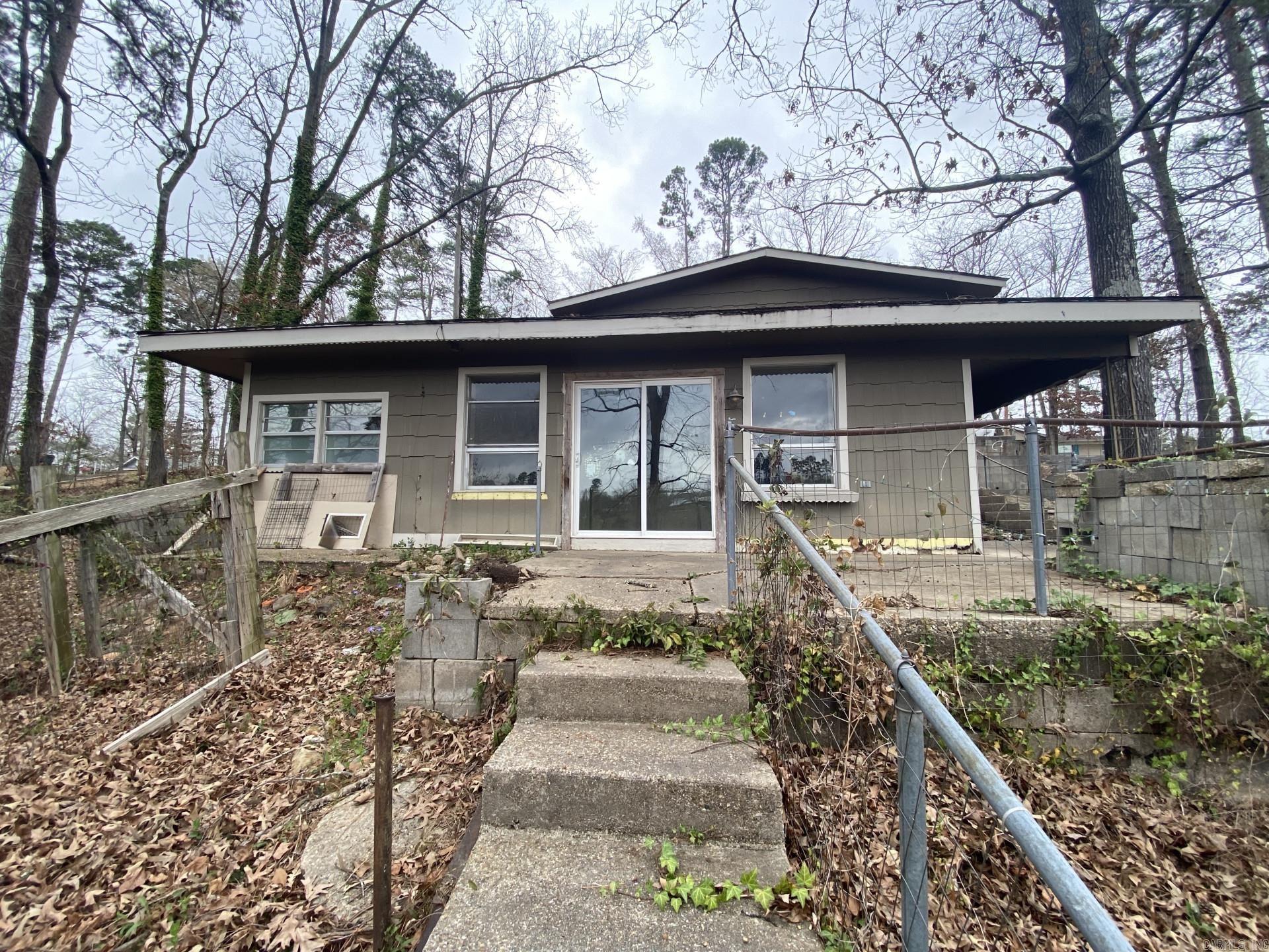 single-family home located at 428 Houston Drive in Hot Springs, AR. Built in 1928, this historic home features 1 bathroom and 1,324 sq.ft. of finished living space. Situated on the main channel of Lake Hamilton the  lot spanning 7,000 sq.ft., this property offers plenty of outdoor space for relaxation and entertaining. Being sold as is. House in poor condition.