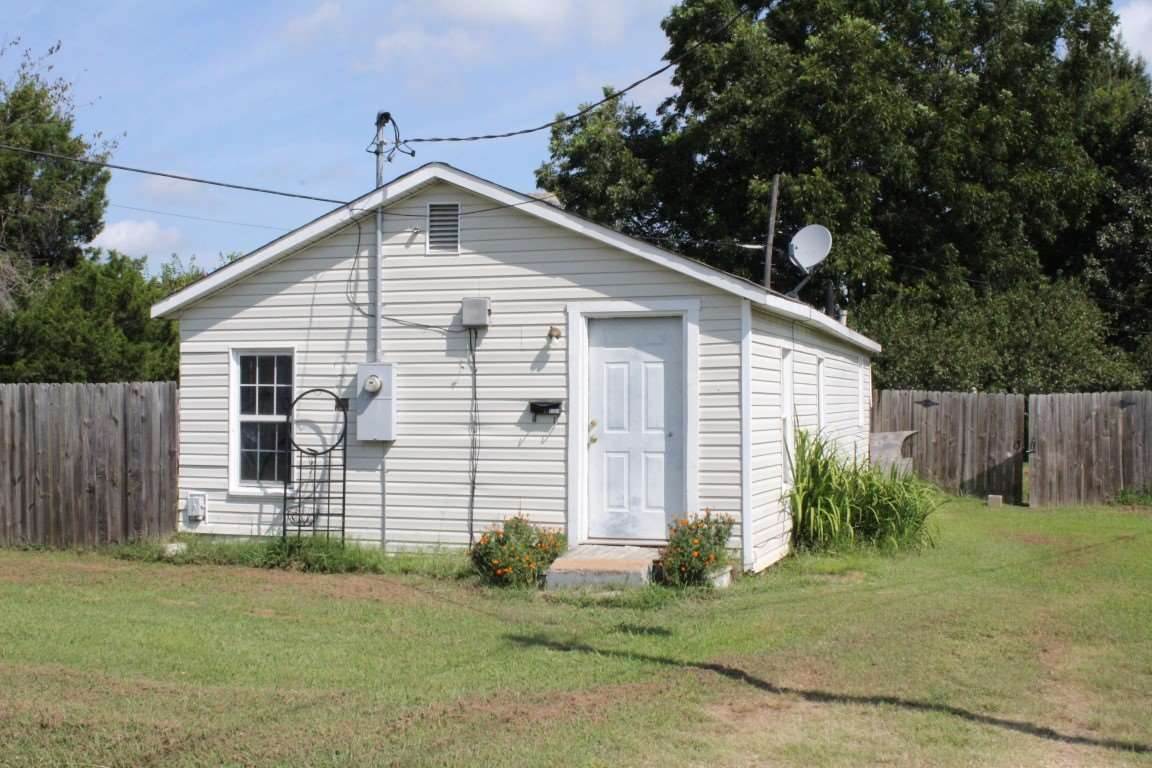 Two homes on a corner lot in the Nettleton School District. The first property includes newly installed wood laminate flooring in the living areas. The eat-in kitchen boasts wood cabinetry & ceramic tile flooring. Family room w/easy access to the kitchen. Other amenities include a screened porch & partially fenced yard. The second house includes wood laminate floors in the kitchen & family room and a full bath with ceramic tile. Also included is a laundry area & wood fence. Great investment or starter home.