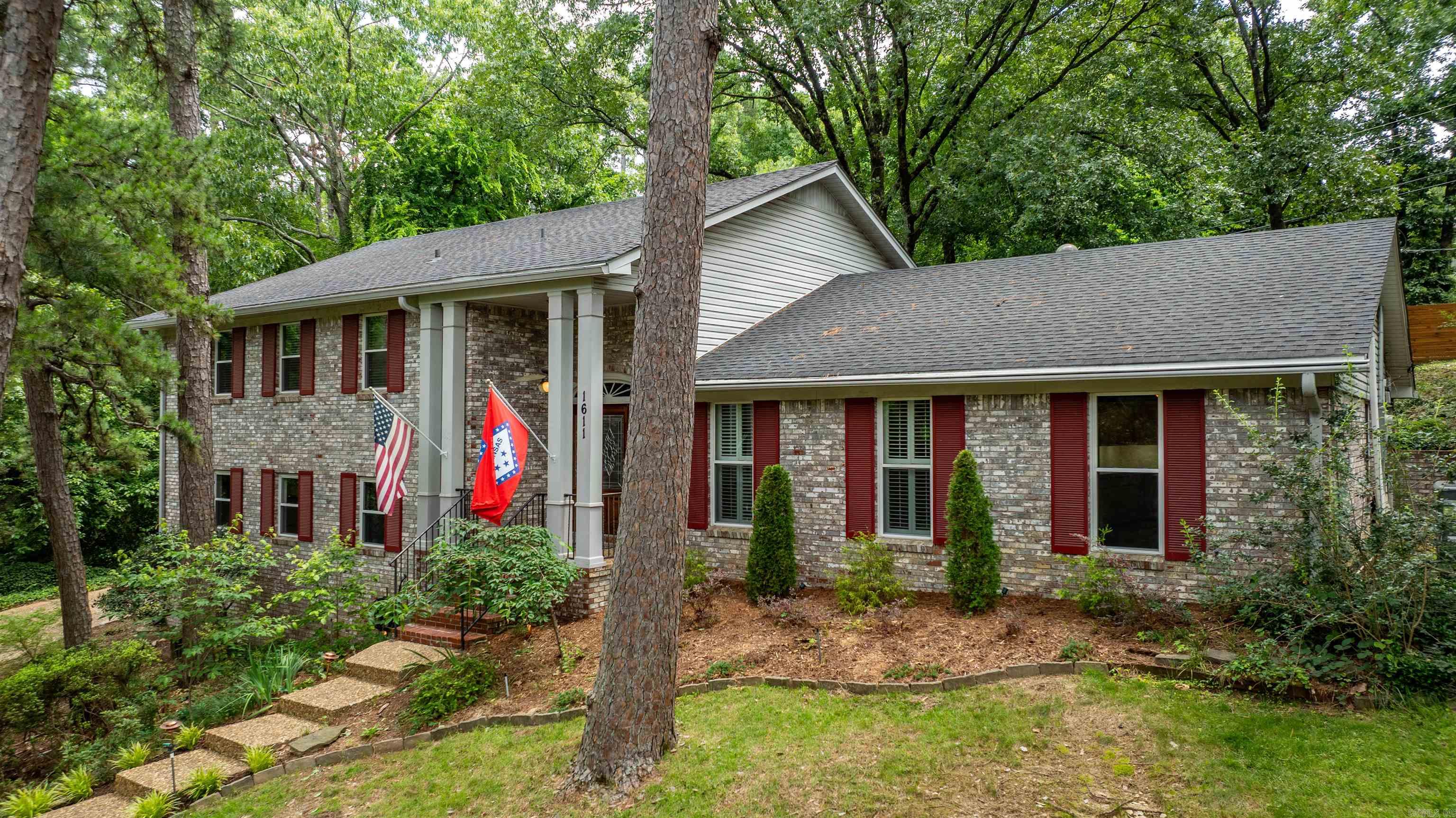 Welcome to your own private retreat in the middle of one of Little Rock's most desirable neighborhoods!  Timeless charm meets modern comfort in this beautifully maintained traditional home, perfectly situated on a quiet, tree-lined street. With 4 spacious bedrooms, 3 full bathrooms, 2 living areas, and a flex room, it offers versatile space for work, play, and everyday life.  Outside is your private oasis: a sparkling pool framed by mature landscaping, a lush lawn, and a fully fenced backyard for total seclusion. A covered patio sets the stage for alfresco dining, weekend lounging, and summer gatherings.  With a new roof in 2021 and new water heater in 2025, this house is ready for new owners to call it home.  Make your appointment today!