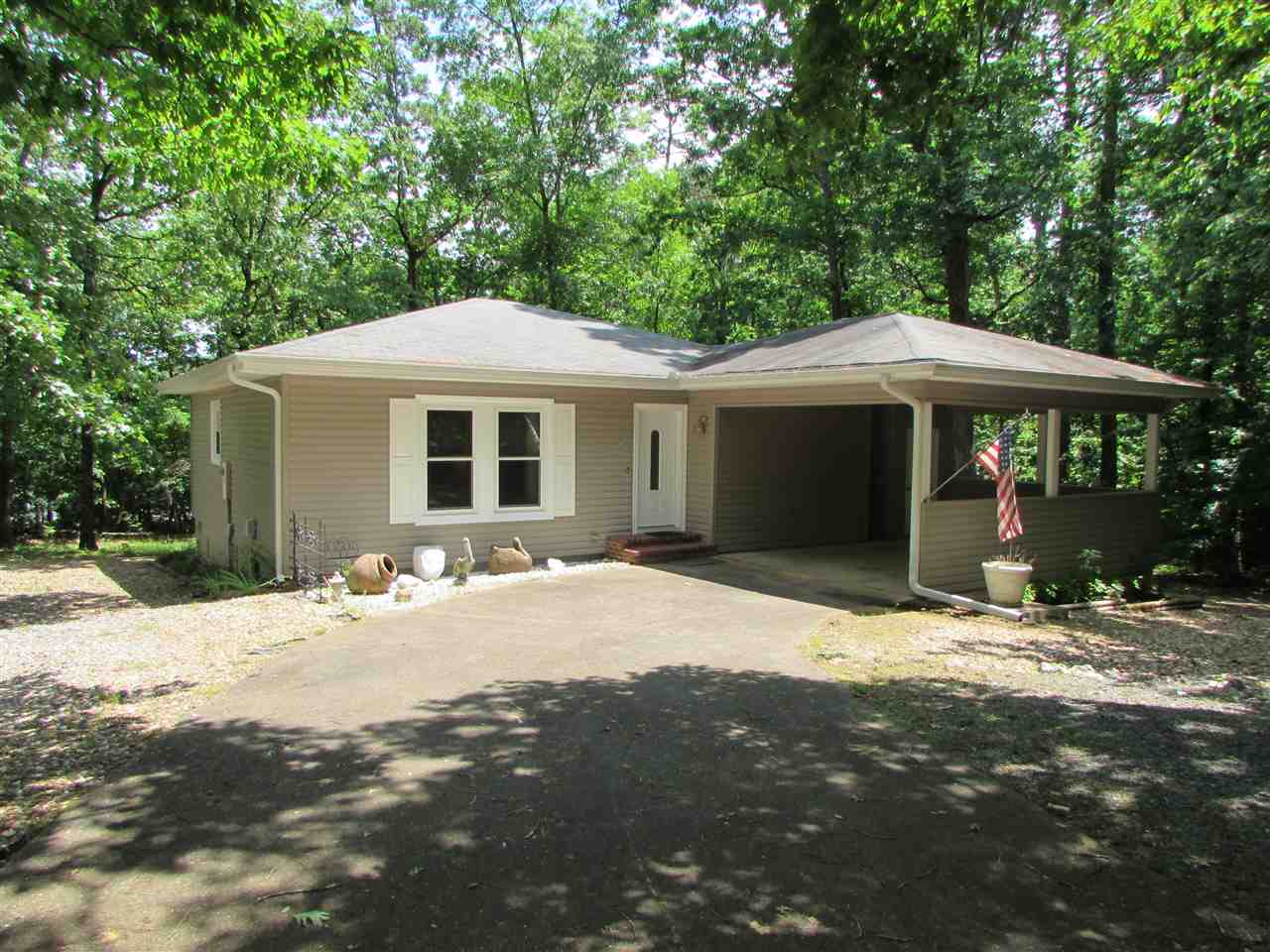 Don't let the year of this house fool you.  It was updated in 2005 with new flooring, interior doors, kitchen cabinets, windows and sliding glass door.  In 2009 new vinyl siding.  This has been a second home and you will love it as soon as you see it.  Furnishings are negotiable.  Great deck that is partially covered overlooking the woods.